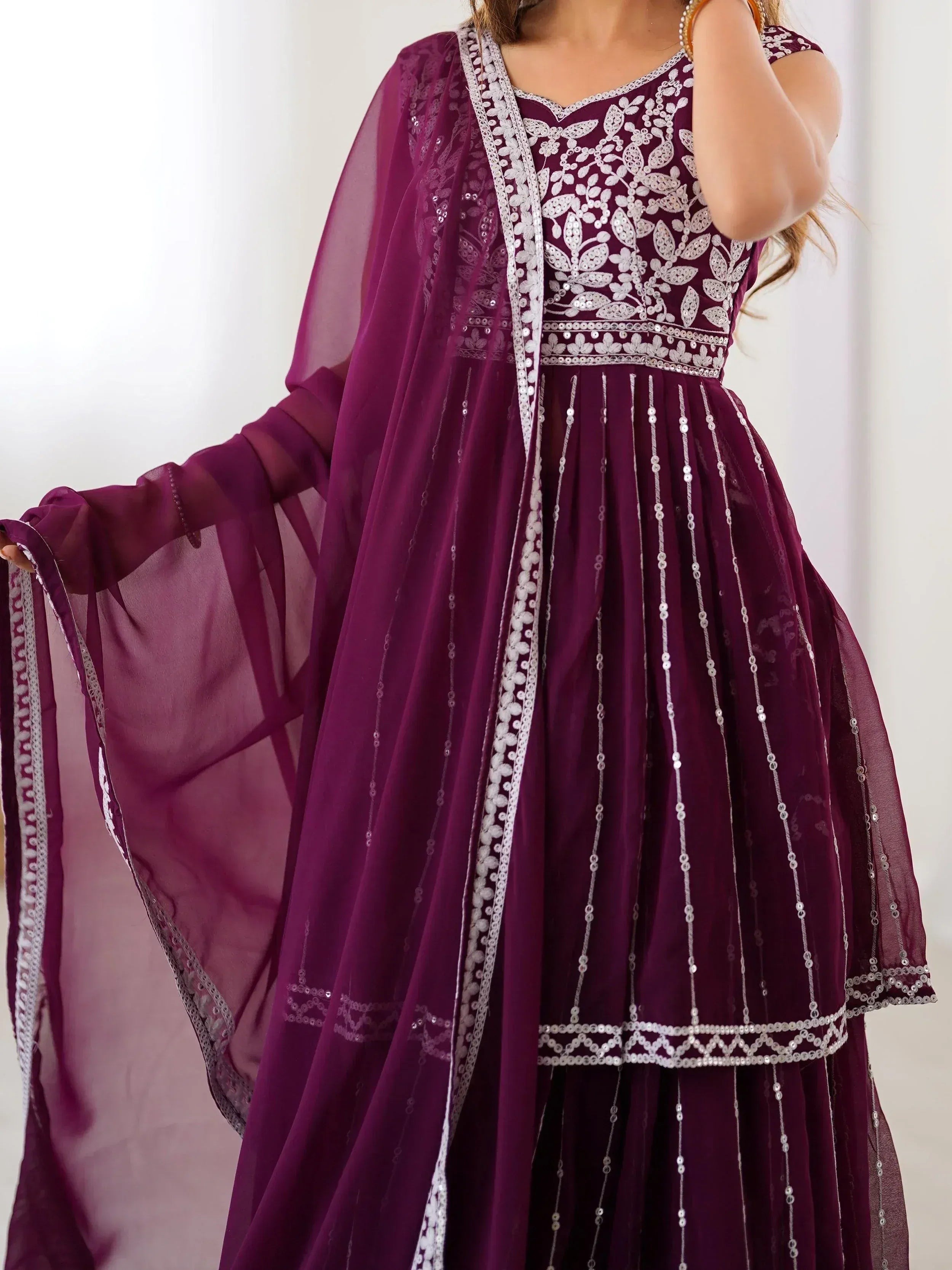 Purple ethnic gown with silver embroidery and sequins, perfect for Indian occasions