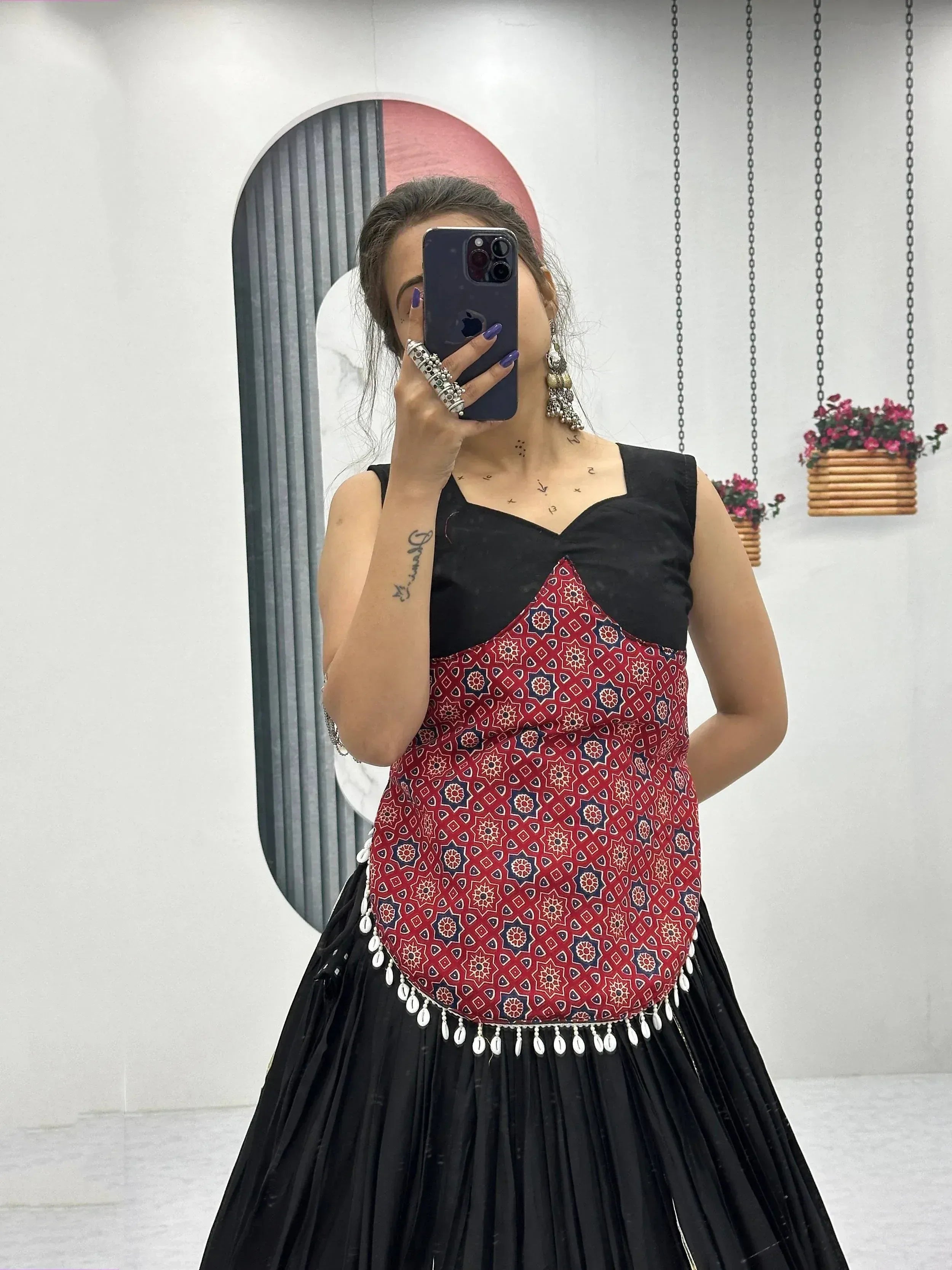 Black and red printed ethnic gown with shell trim, perfect for Indian festive occasions