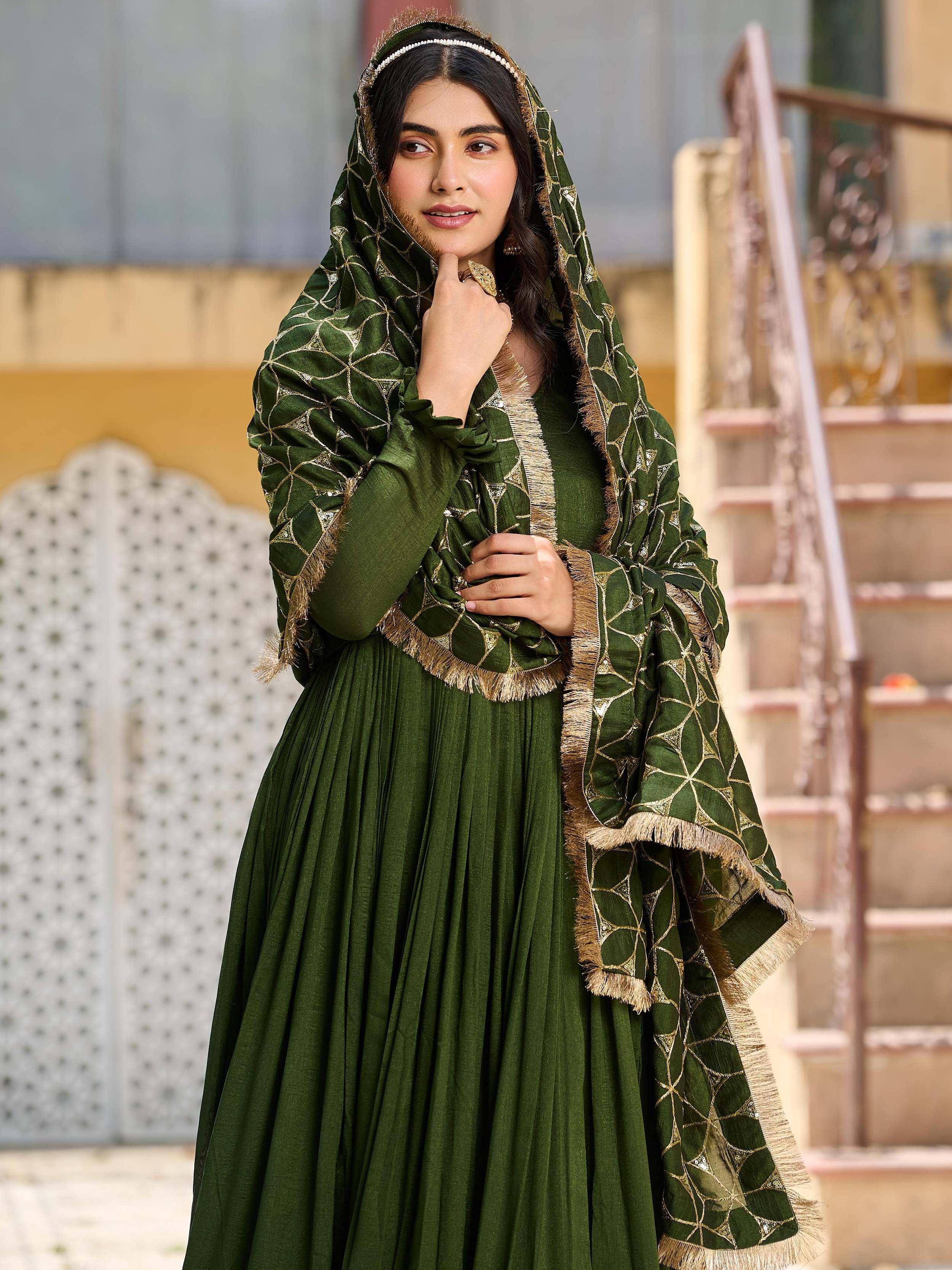 Elegant green ethnic gown with gold geometric print dupatta, perfect for Indian festive occasions