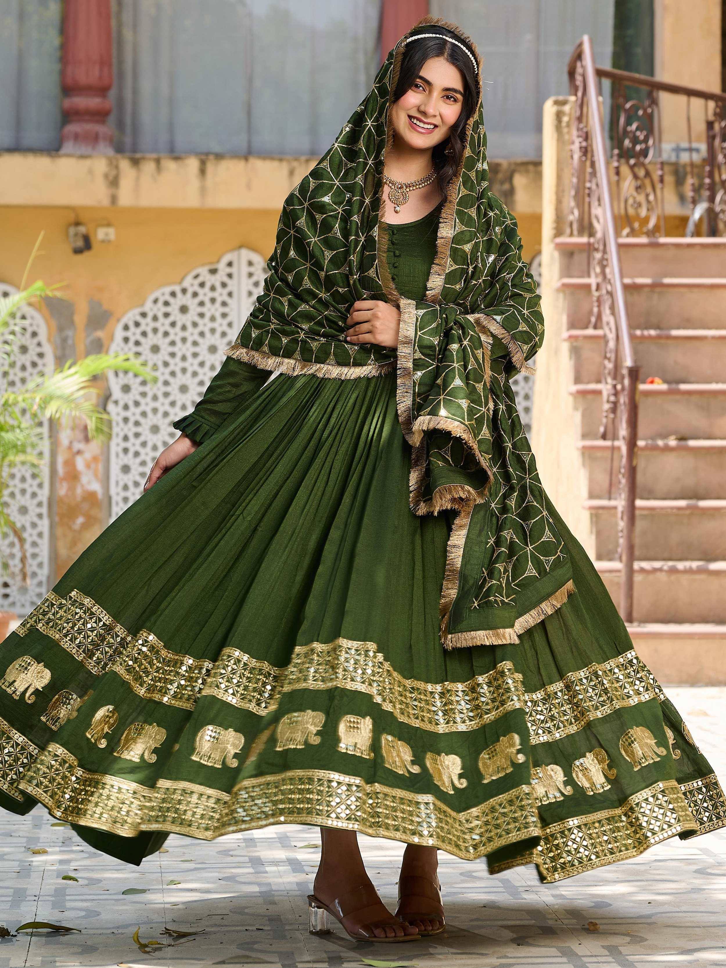 Green ethnic anarkali with gold elephant embroidery and dupatta, perfect for Indian festive occasions