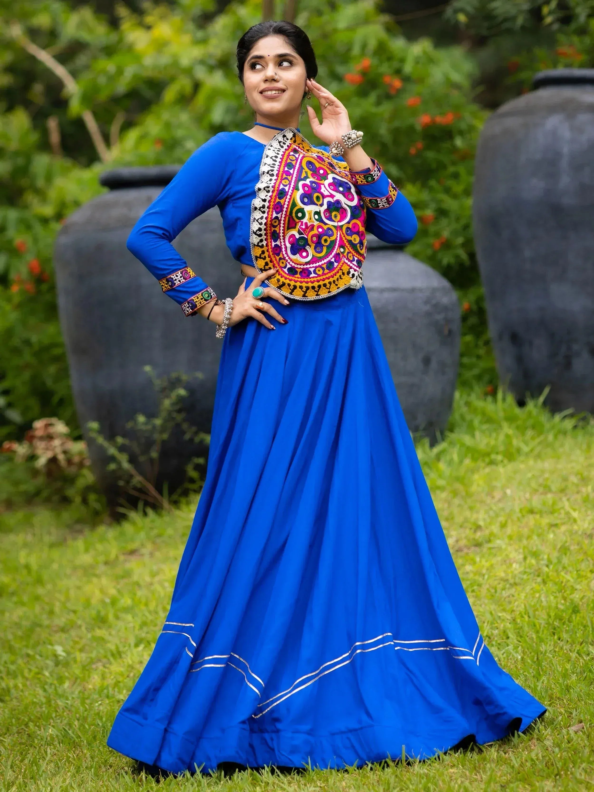 Blue ethnic gown with colorful mirror work, perfect for Indian festive occasions and weddings.