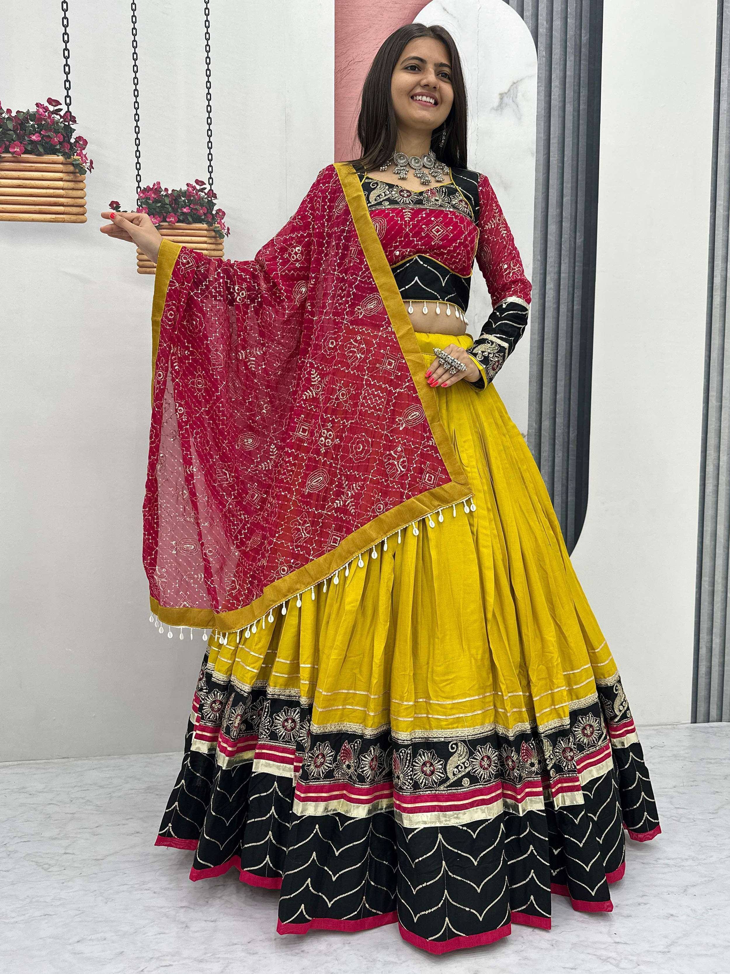 Vibrant yellow and red lehenga choli with intricate embroidery and matching dupatta for festive occasions