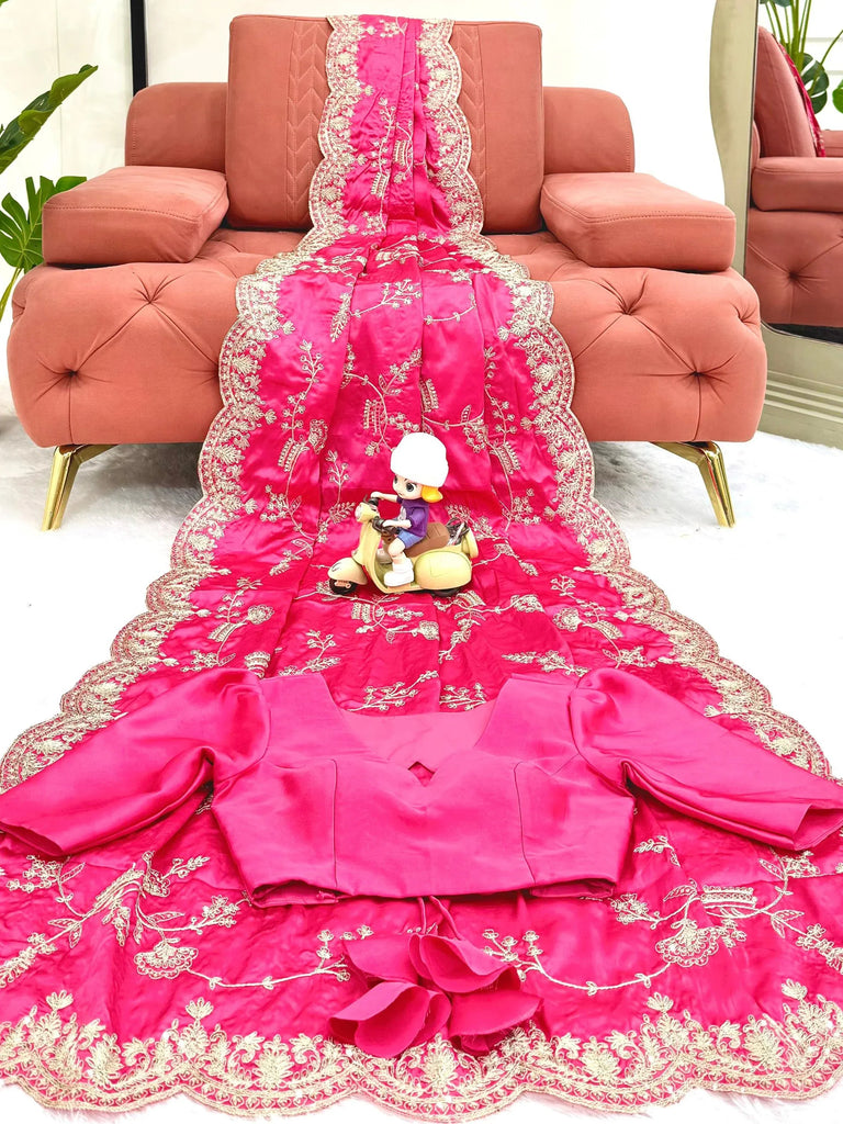 Bright pink designer saree with gold embroidery and matching blouse