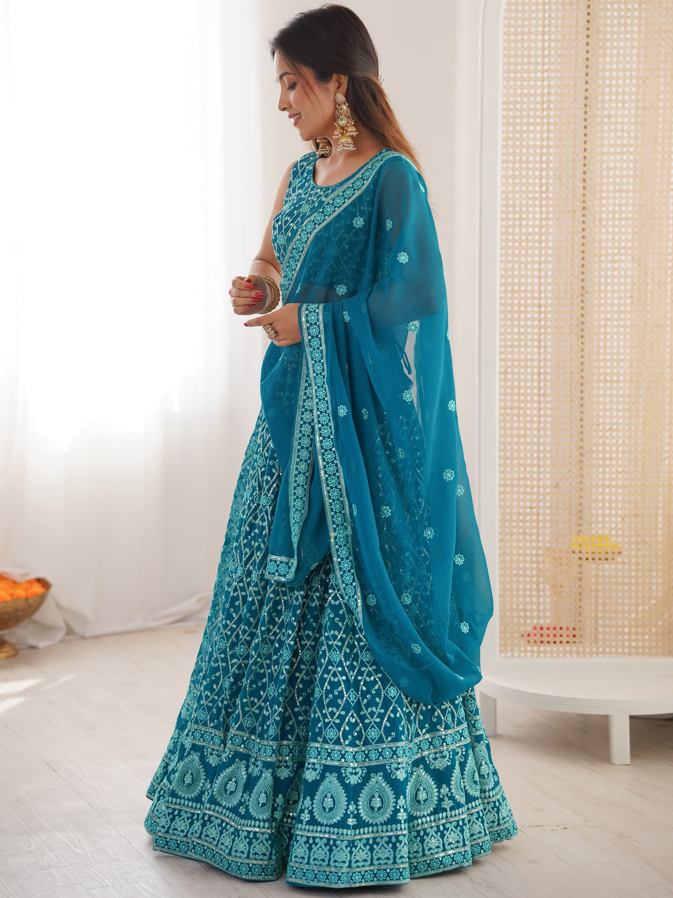 Dazzling Teal Blue Thread Work Georgette Function Wear Lehenga Choli