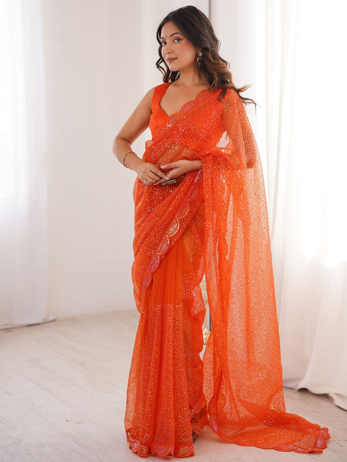 Captivating Orange Sequins Net Traditional Saree With Blouse