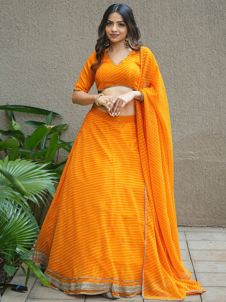 Amazing Orange Laheriya Print Georgette Haldi Wear Lehenga Choli
