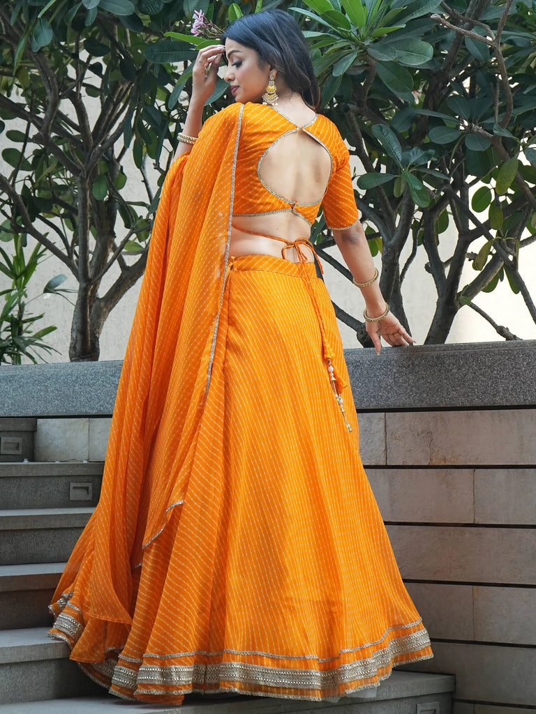 Amazing Orange Laheriya Print Georgette Haldi Wear Lehenga Choli