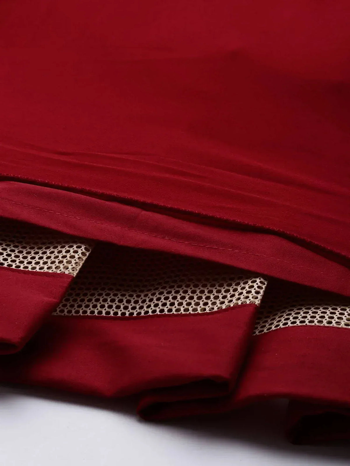 Rich maroon ethnic wear fabric with gold mesh detailing, perfect for designer lehenga or saree
