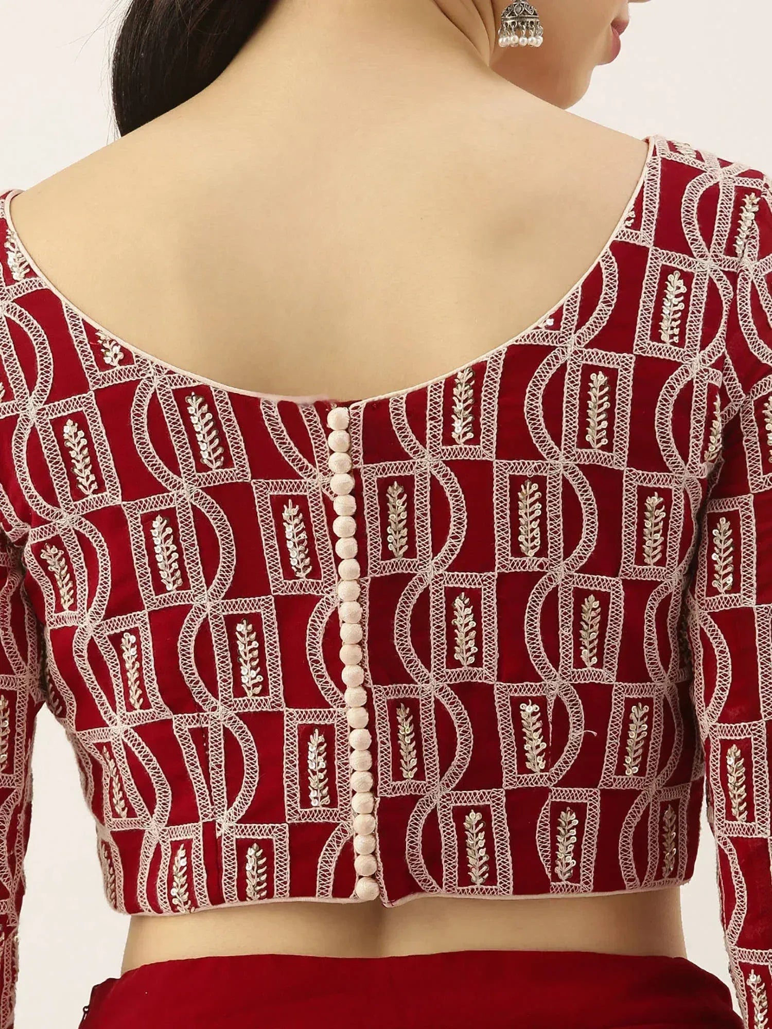 Red embroidered lehenga choli blouse with geometric pattern and pearl buttons, ethnic Indian wear