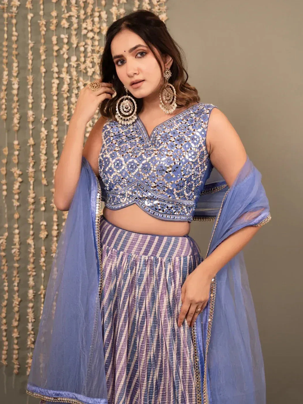 Blue embroidered lehenga choli with striped skirt and sheer dupatta, perfect for Indian ethnic wear