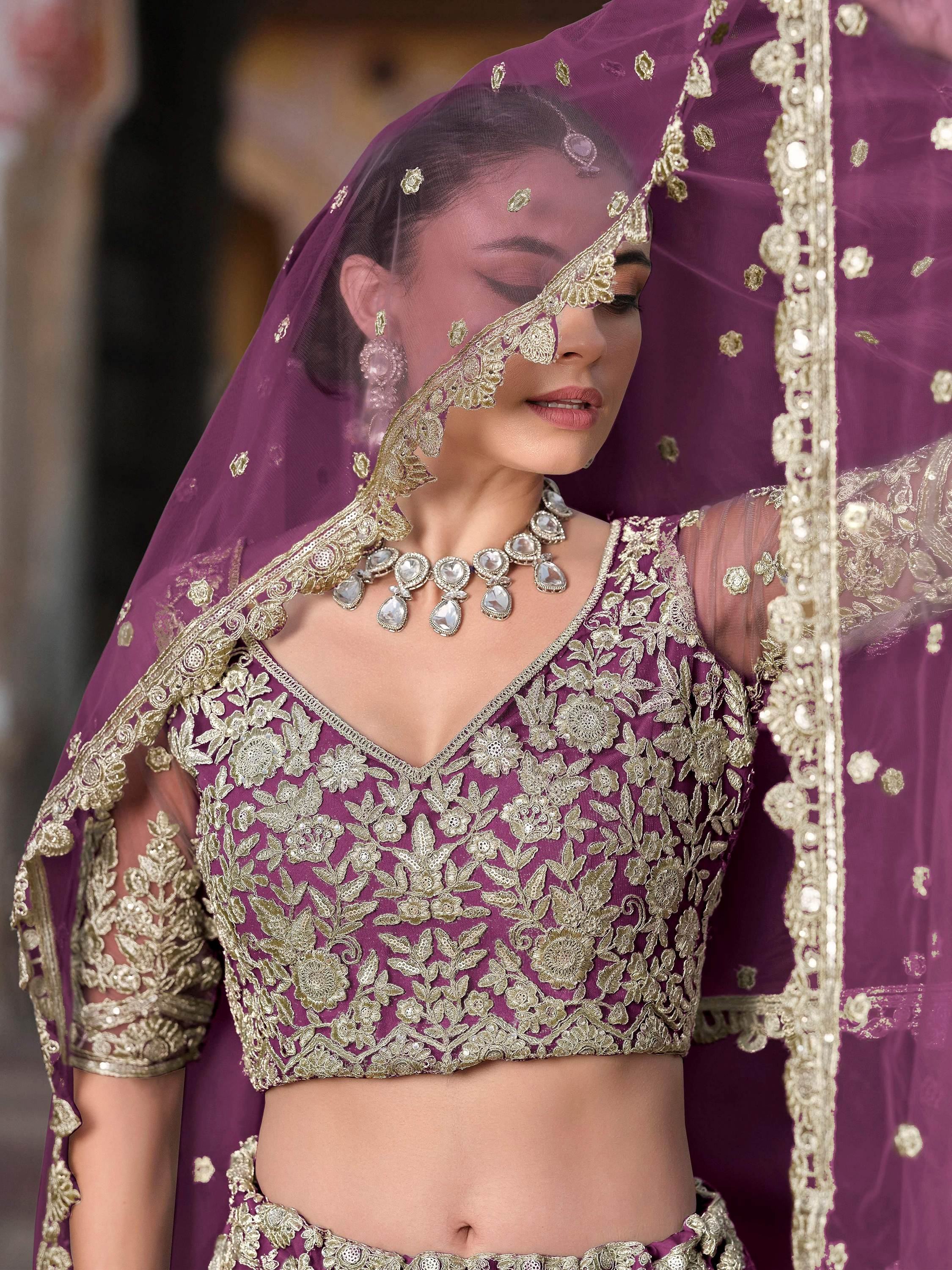 Lovable Purple Embroidered Net Engagement Wear Lehenga Choli