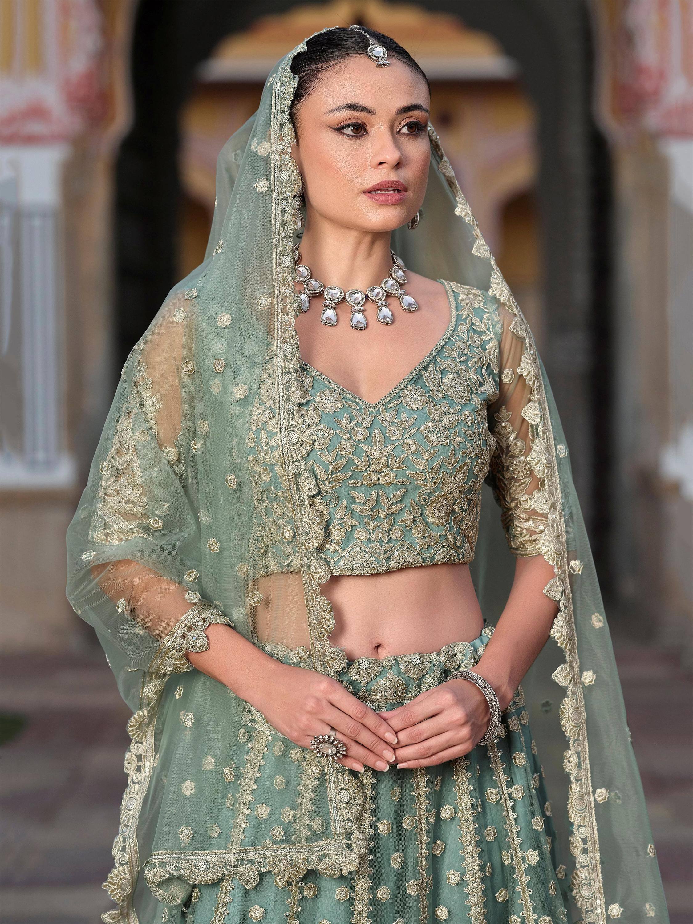 Mint green embroidered lehenga choli with sheer dupatta, perfect for Indian weddings and ethnic events