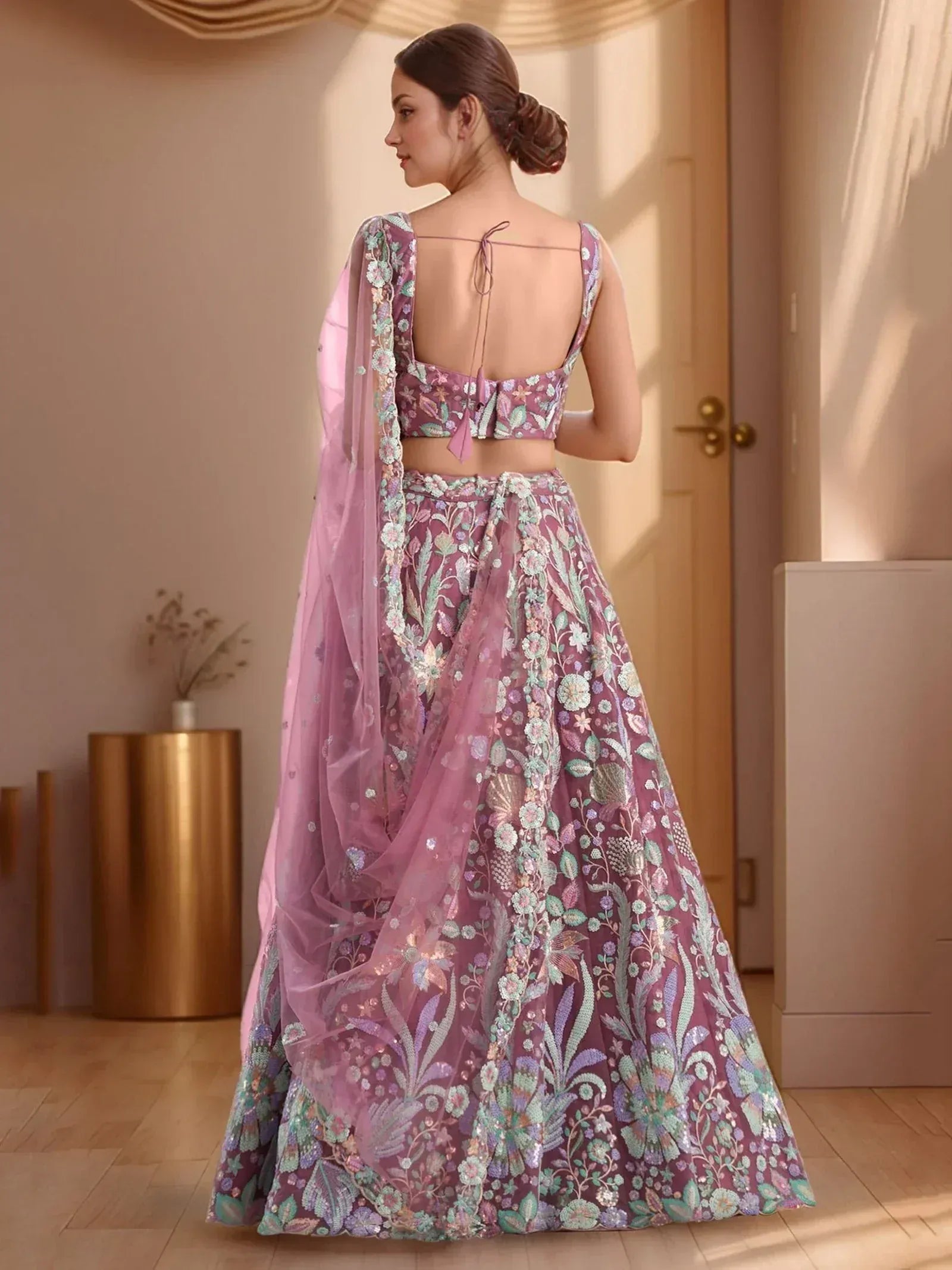 Elegant purple lehenga choli with floral embroidery and sheer dupatta, perfect for Indian ethnic occasions