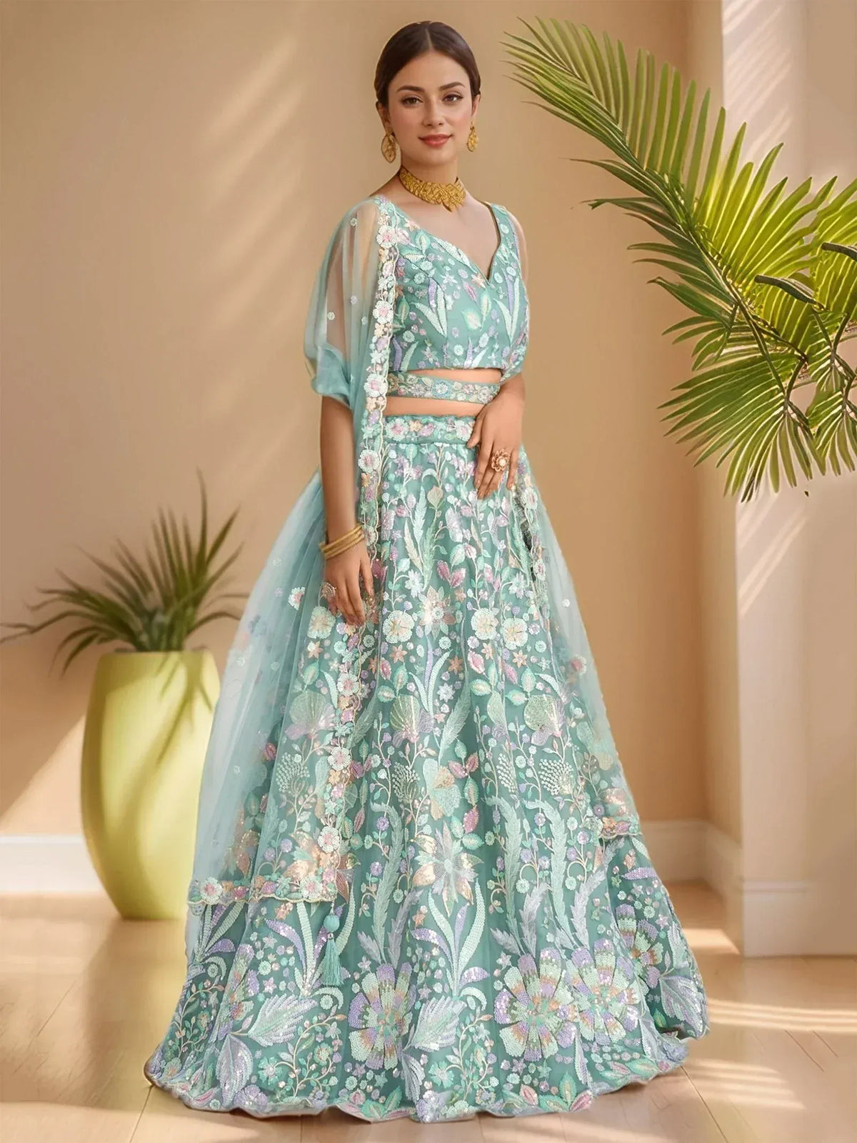 Mint green floral embroidered lehenga choli with sheer dupatta, perfect for Indian weddings and festive occasions.