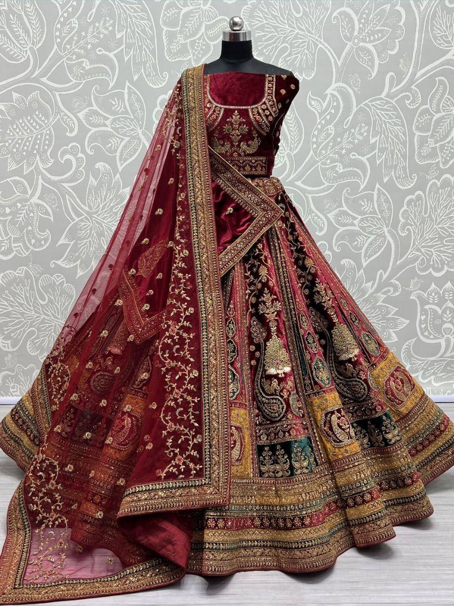 Maroon velvet designer lehenga choli with gold embroidery and sheer dupatta, ethnic Indian wedding wear