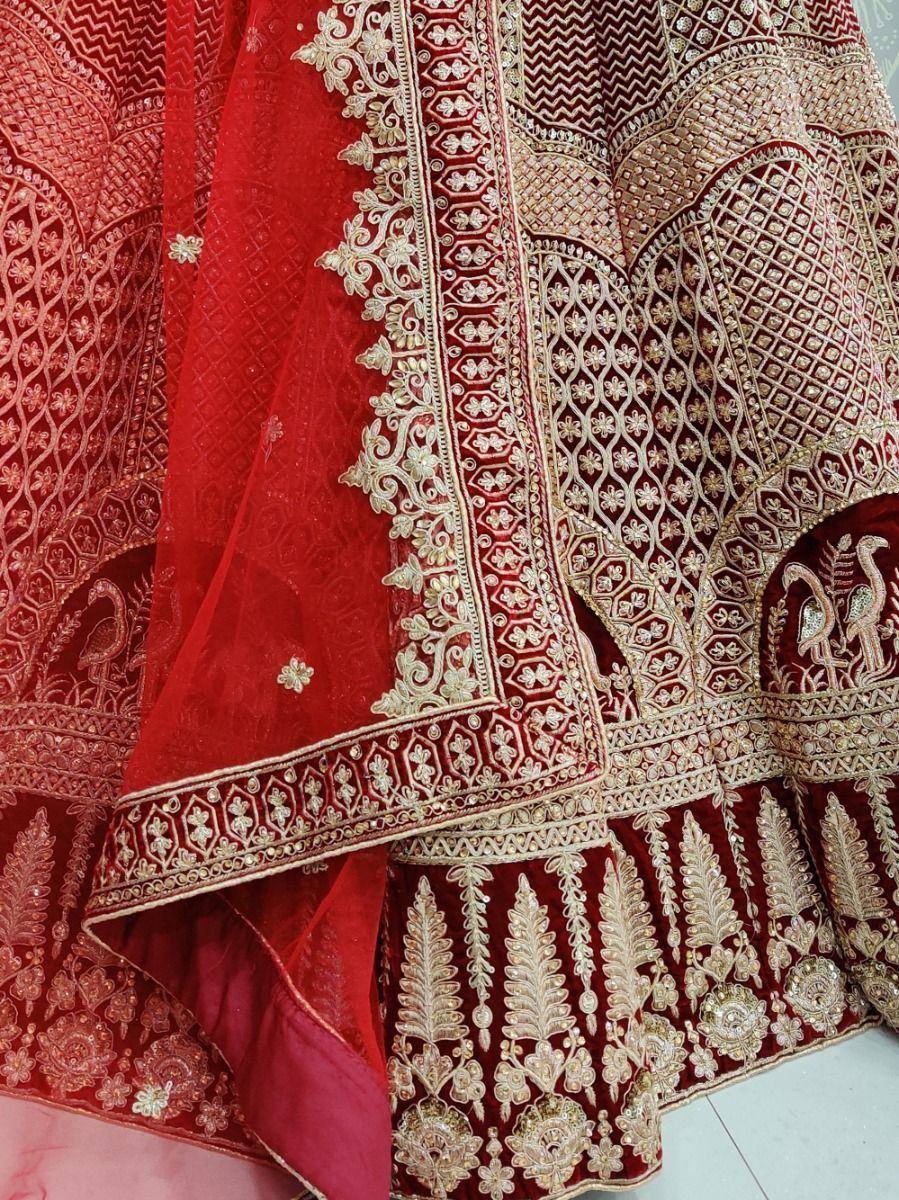 Red velvet lehenga choli with gold embroidery and peacock motifs, Indian ethnic wear