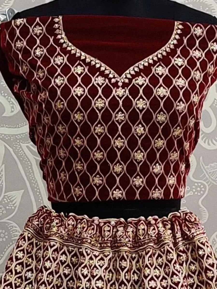 Maroon velvet lehenga choli with gold floral embroidery, ethnic Indian wear