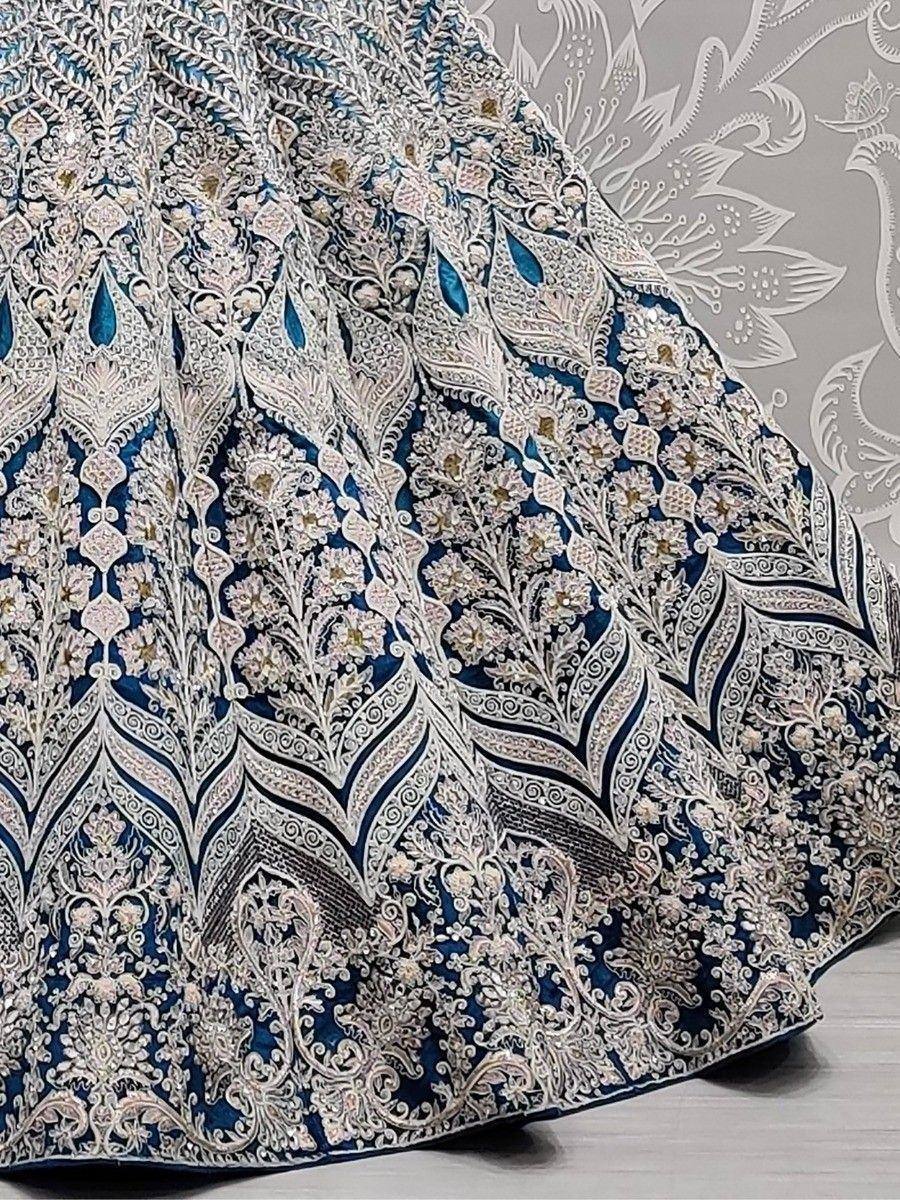Blue and silver embroidered lehenga skirt with intricate floral and paisley designs, perfect for Indian ethnic wear.