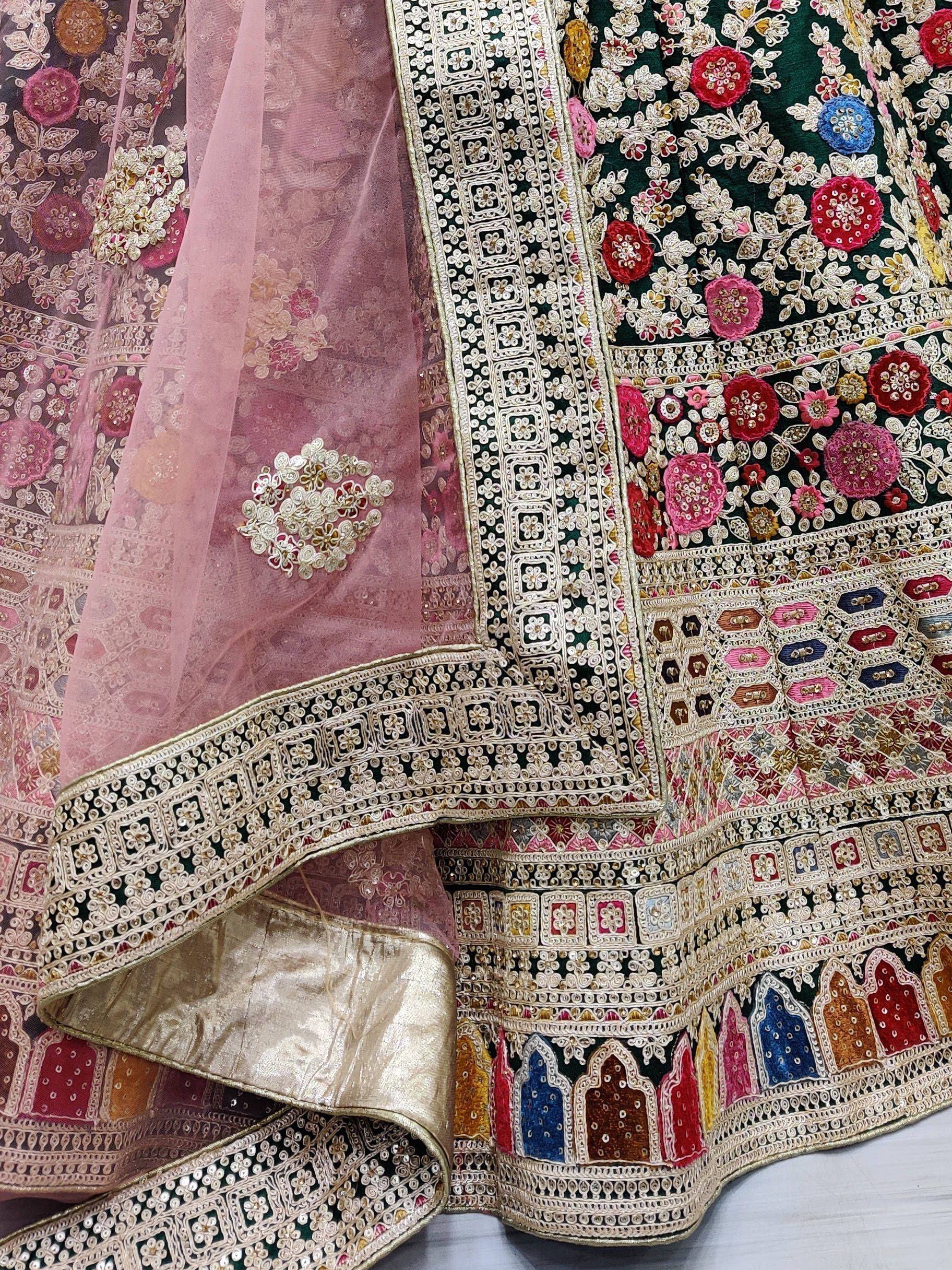 Designer lehenga choli with heavy floral embroidery, sequins, and pink dupatta for Indian ethnic wear