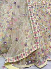 Outstanding Yellow Mirror Work Net Party Wear Lehenga Choli