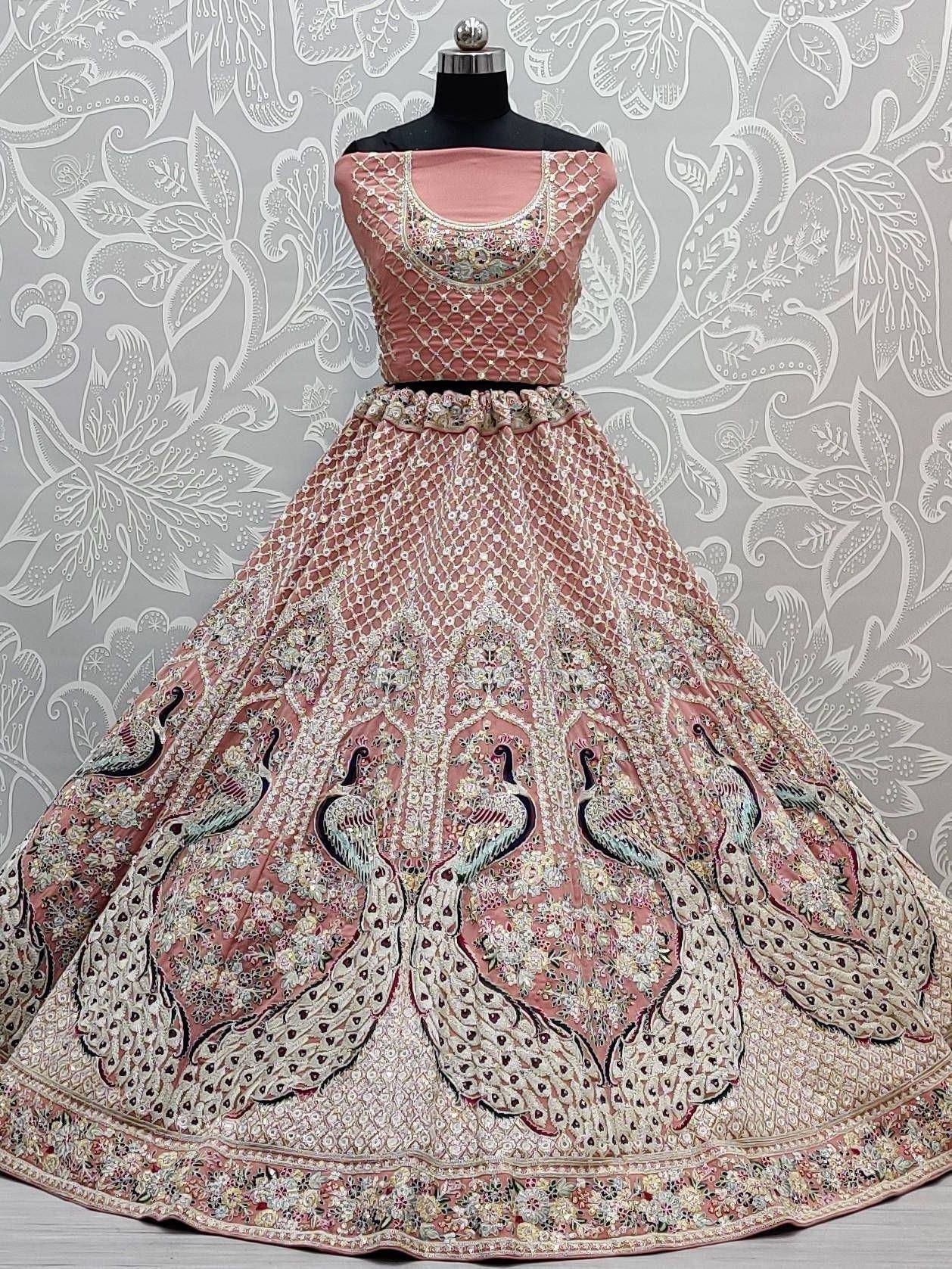 Pink designer lehenga choli with peacock embroidery and net overlay, ethnic Indian wear