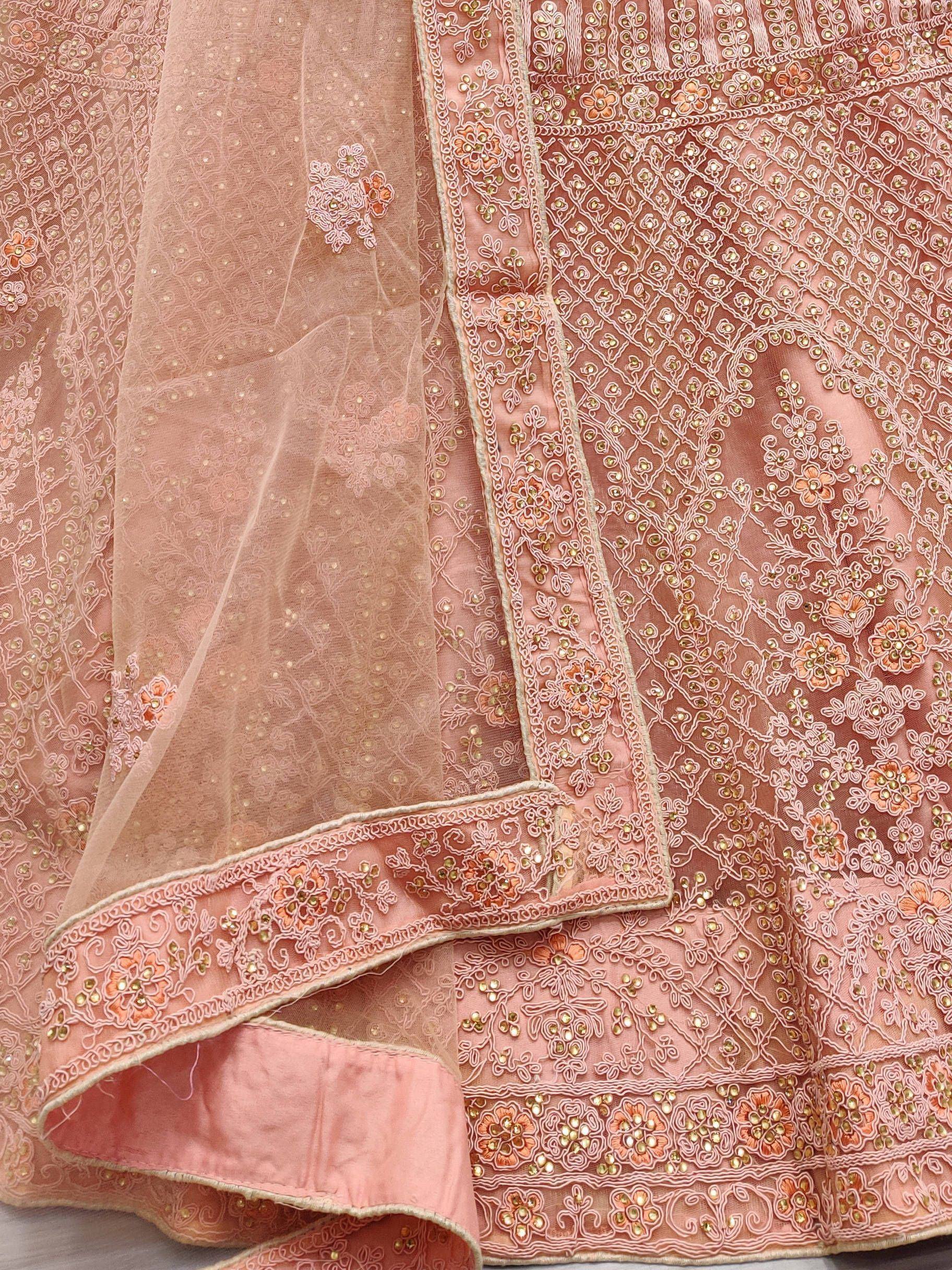 Pink embroidered lehenga choli with floral zari work and sheer dupatta, ideal for Indian ethnic wear