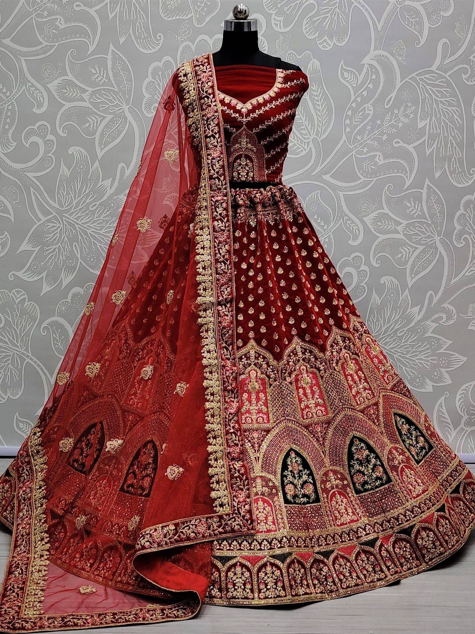 Red velvet lehenga choli with gold embroidery and sheer dupatta, Indian ethnic wear for weddings
