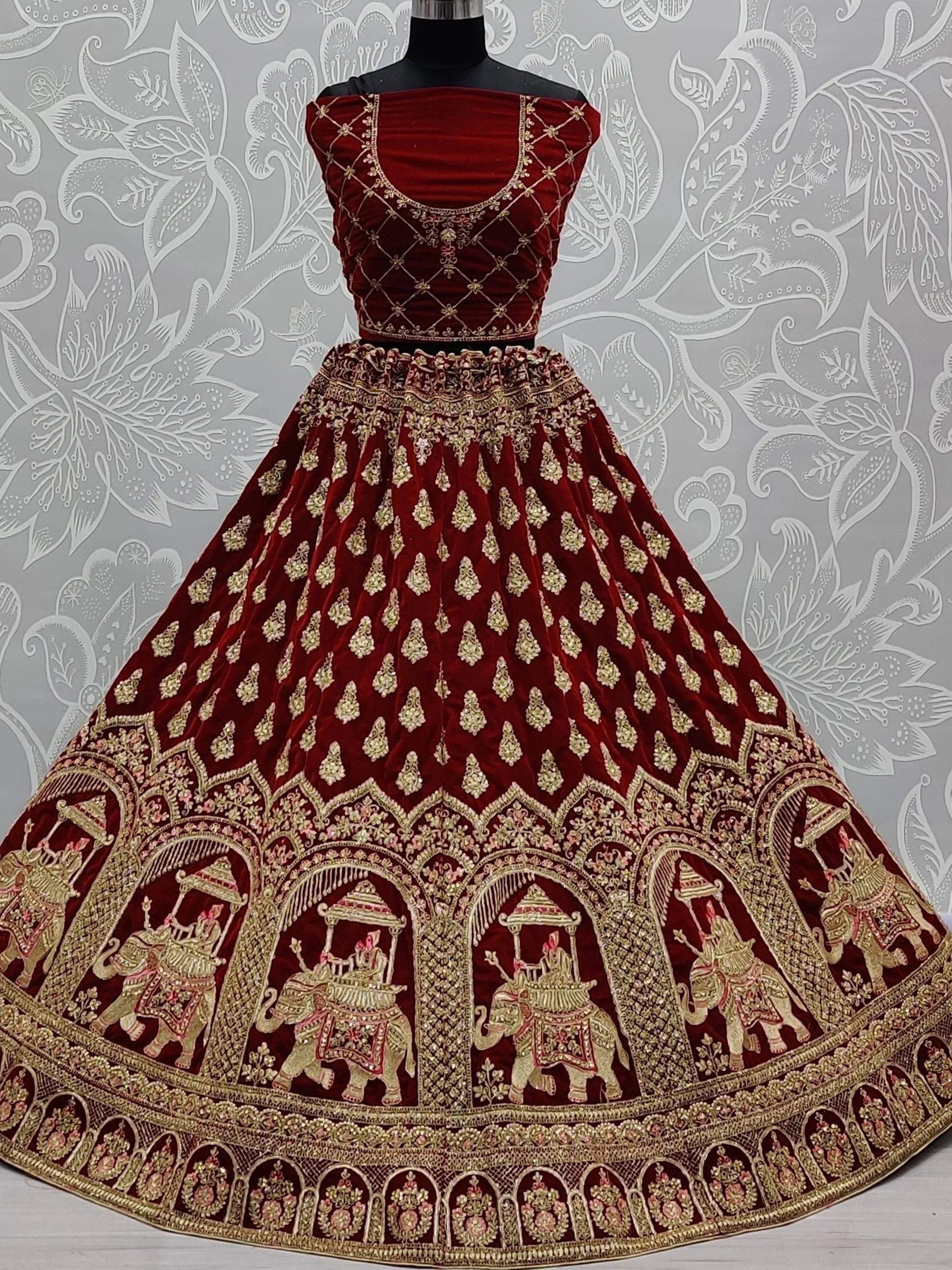 Maroon velvet lehenga choli with gold elephant embroidery, Indian ethnic wear for weddings