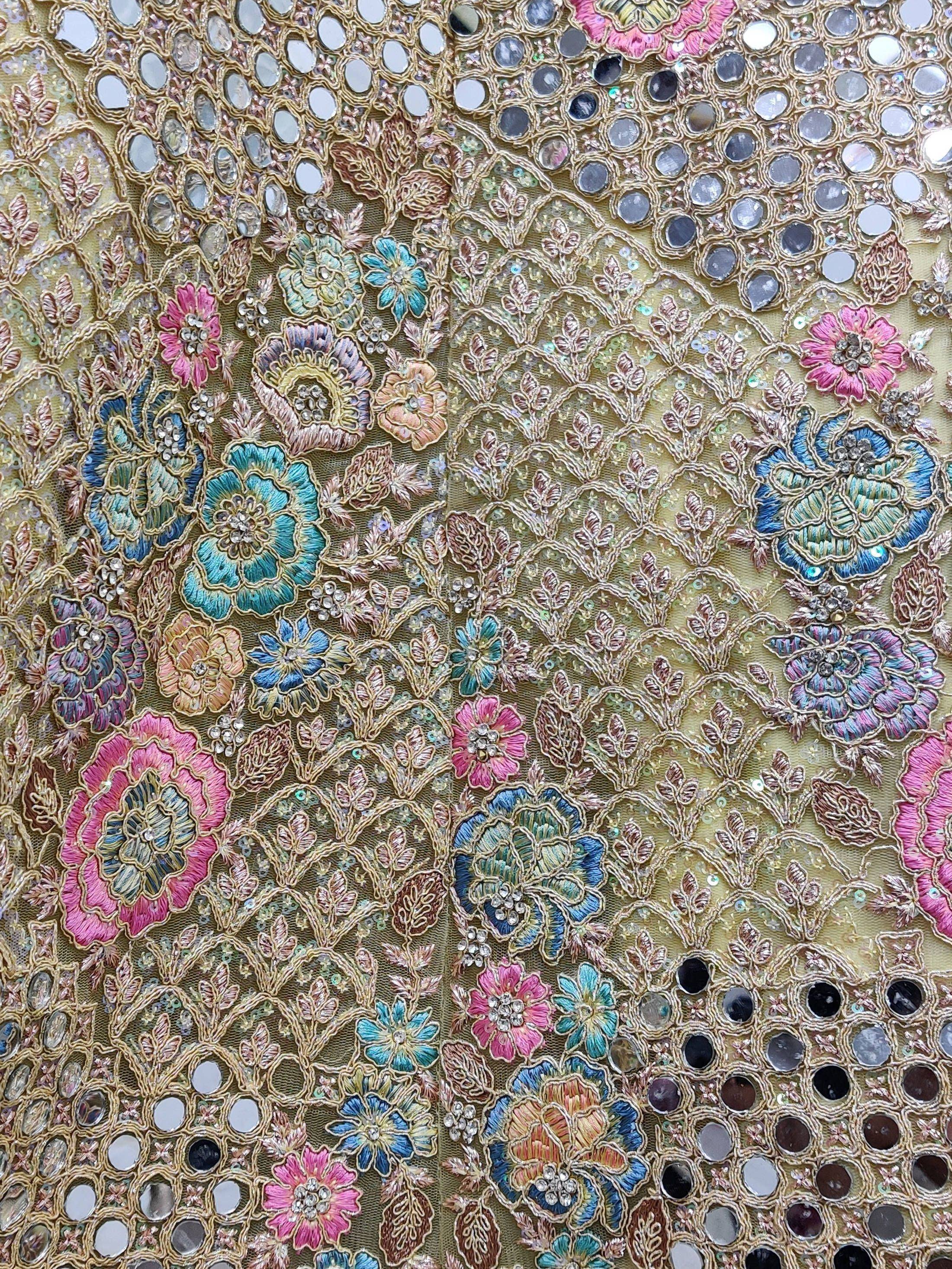 Indian ethnic wear fabric with floral embroidery, mirror work, and sequins for lehenga or saree