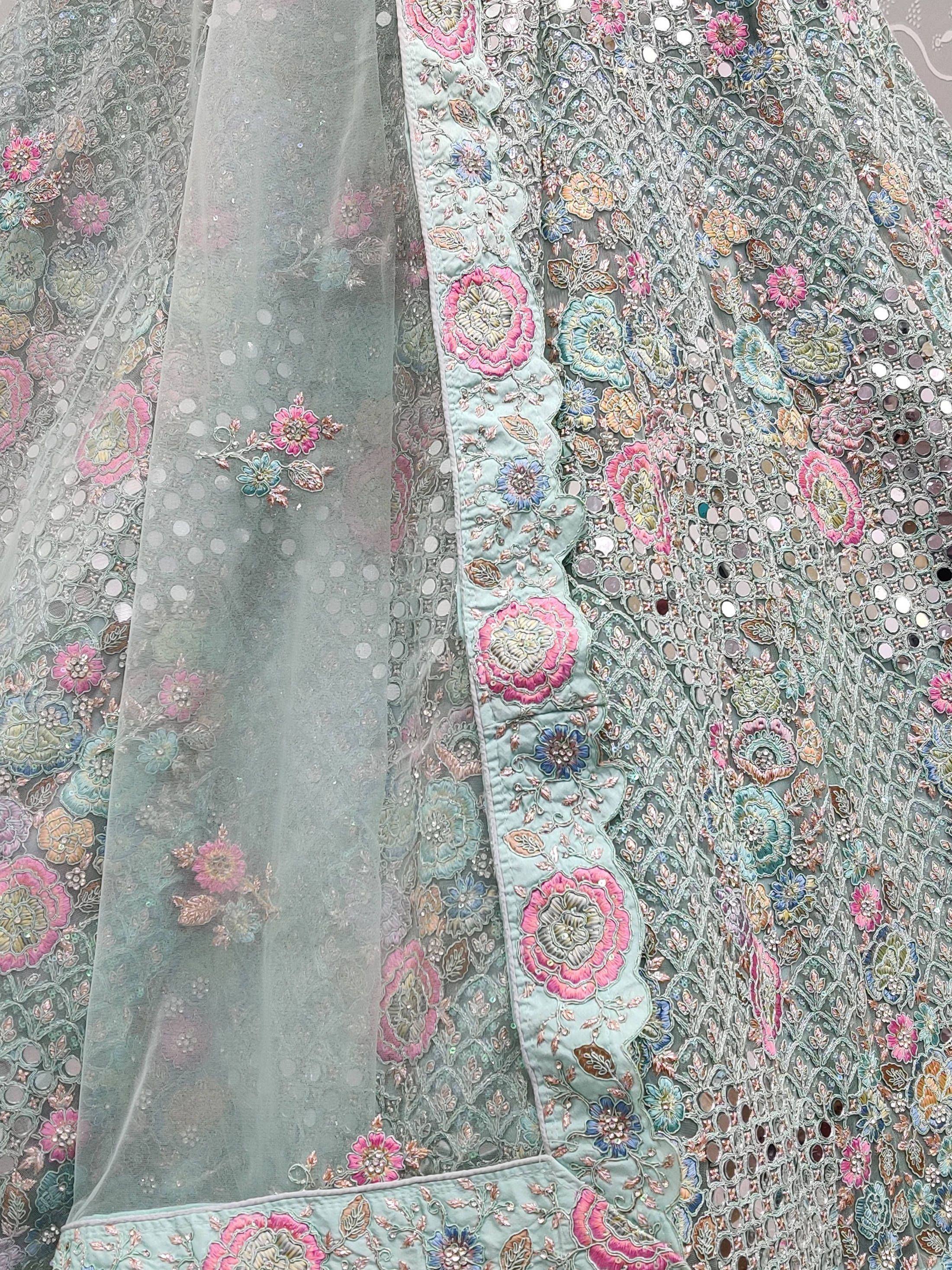 Mint green lehenga with floral embroidery, mirror work, and sheer dupatta for Indian ethnic wear