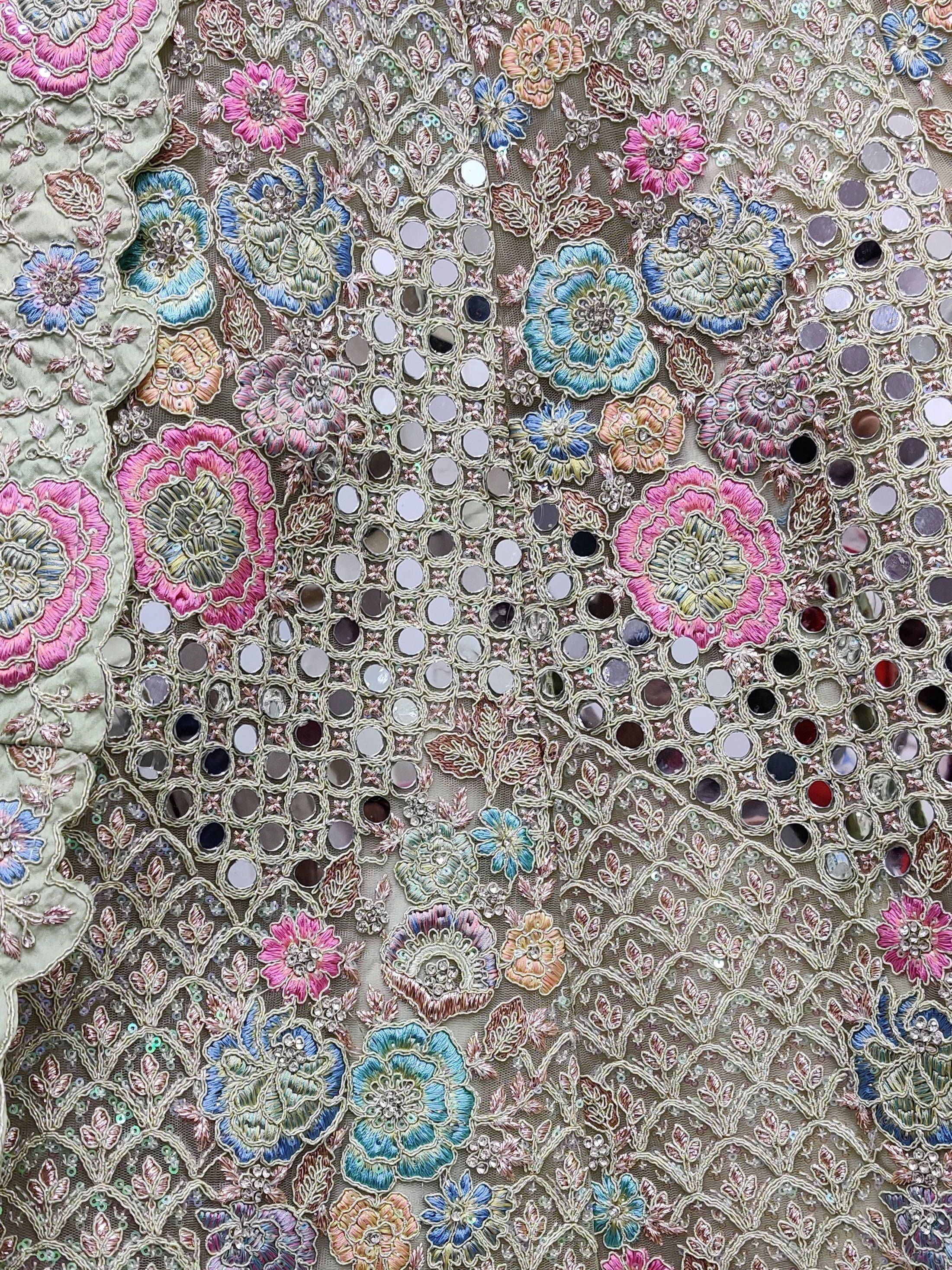 Indian ethnic wear with floral embroidery, mirror work, and sequins for lehenga or saree