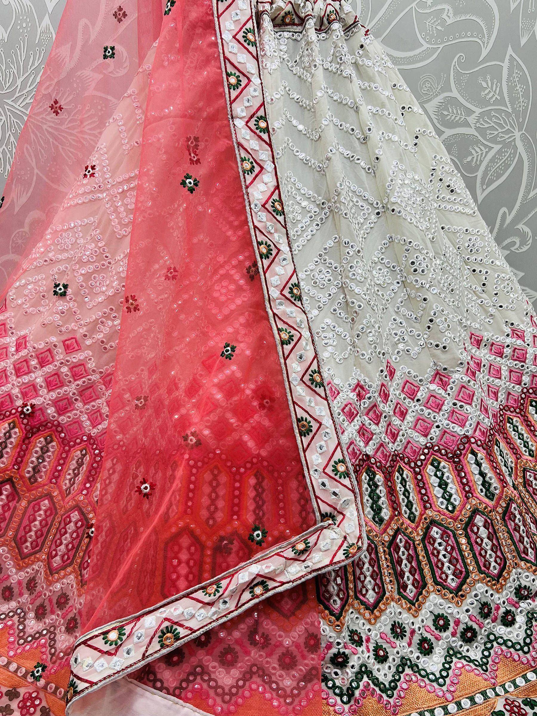 Pink and cream embroidered lehenga choli with mirror work and floral motifs, ideal for Indian ethnic wear