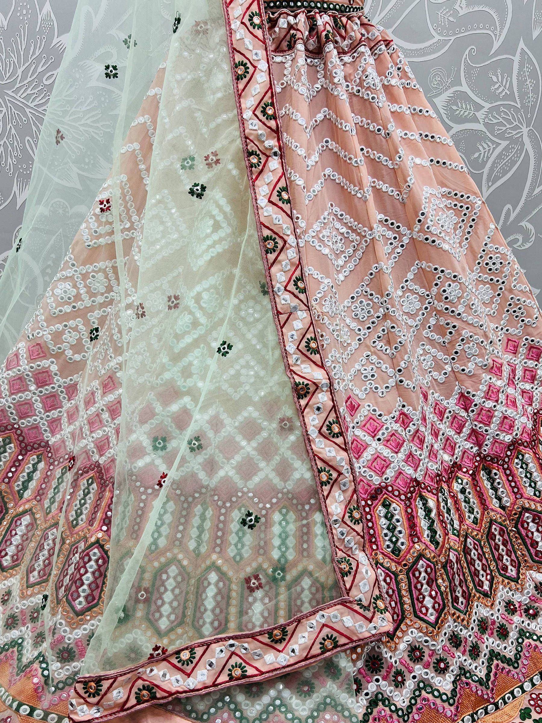 Pink and mint green designer lehenga with mirror work and floral embroidery, perfect for Indian ethnic wear.