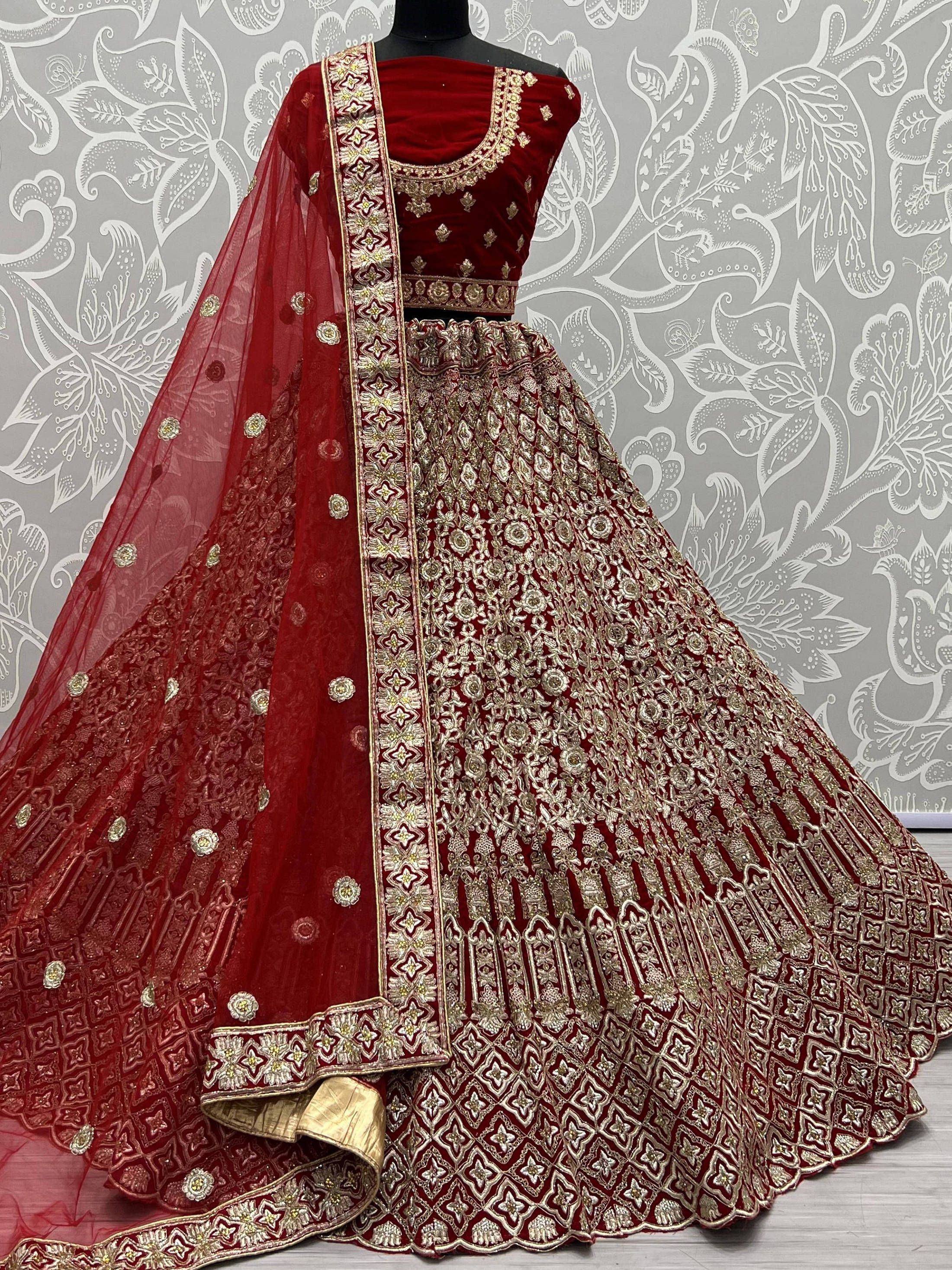 Red velvet designer lehenga choli with gold embroidery and net dupatta, ethnic Indian wear