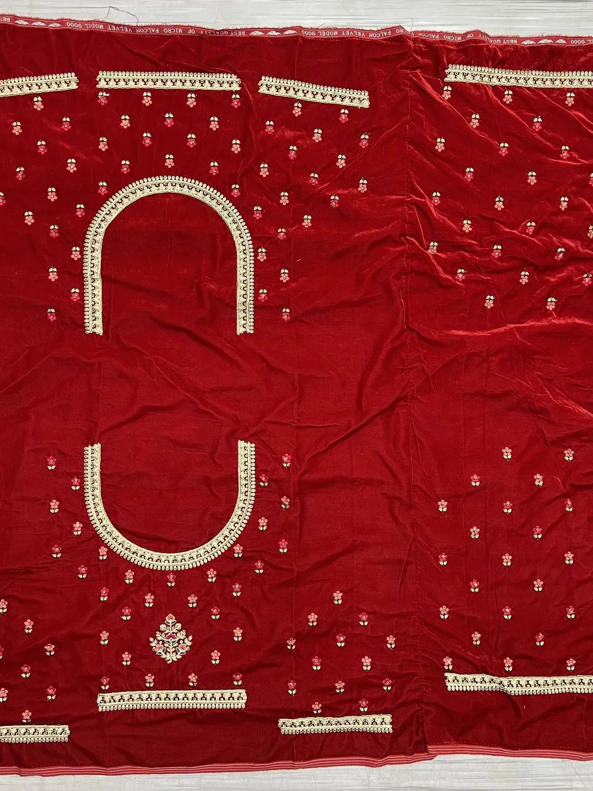 Red velvet ethnic wear fabric with floral embroidery and gold trim, ideal for designer lehenga or saree