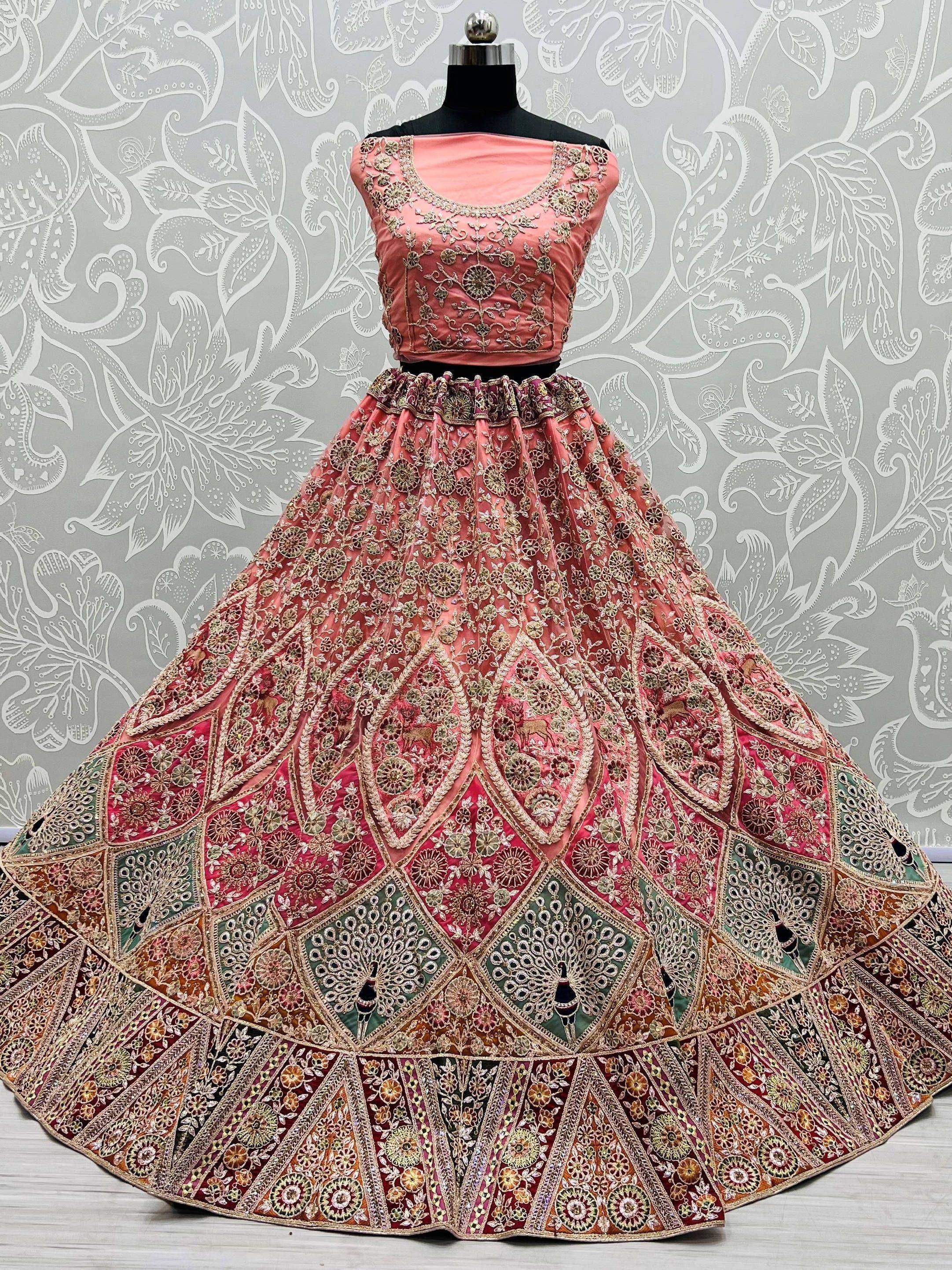 Pink embroidered lehenga choli with floral and peacock motifs, Indian ethnic wear for weddings