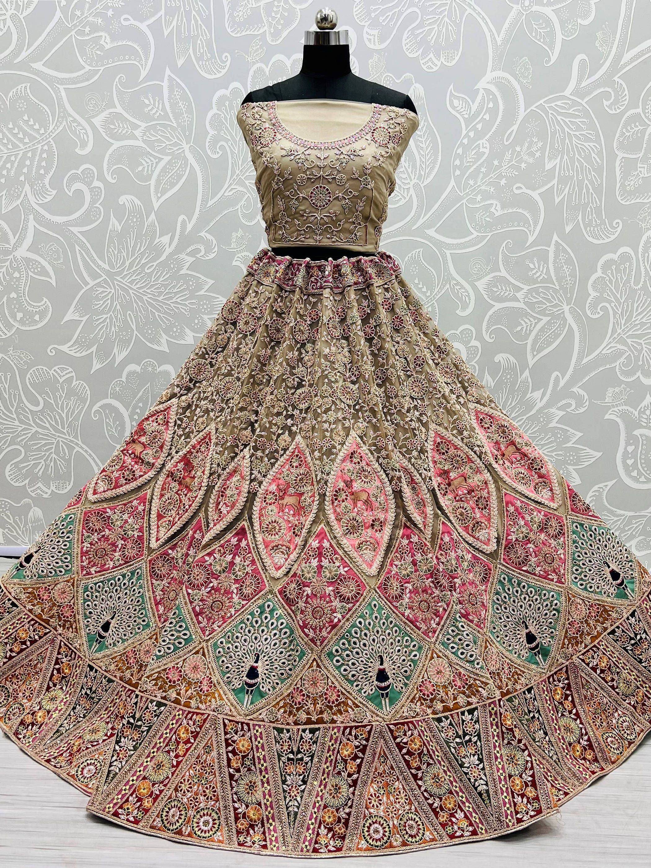 Designer lehenga choli with intricate floral embroidery and colorful patchwork, perfect for Indian ethnic wear.