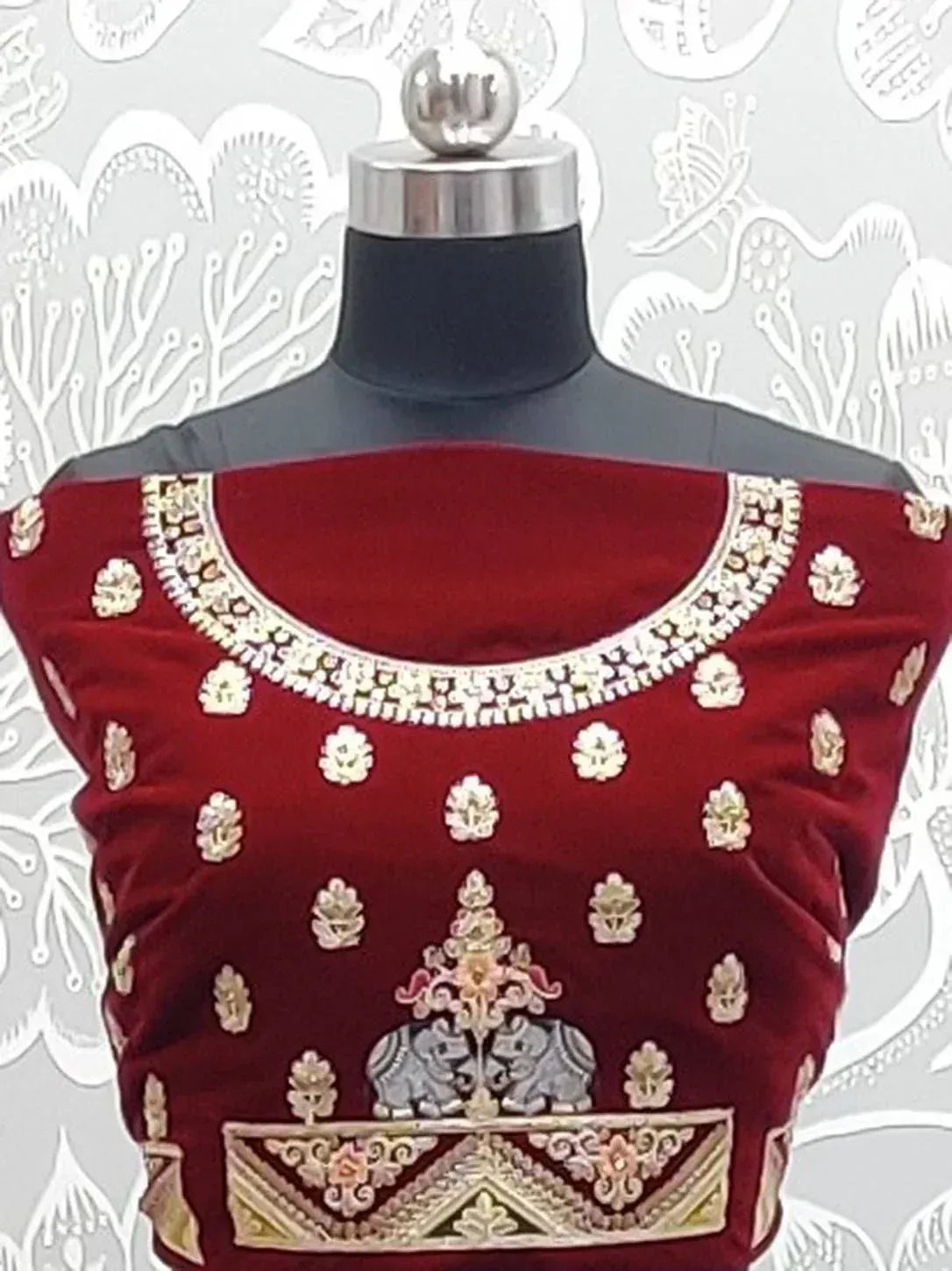 Maroon velvet designer blouse with gold embroidery, elephant motif, and floral patterns for ethnic wear