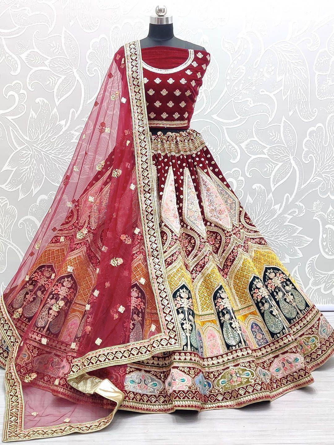 Maroon designer lehenga choli with intricate embroidery and colorful paisley patterns, perfect for Indian ethnic wear