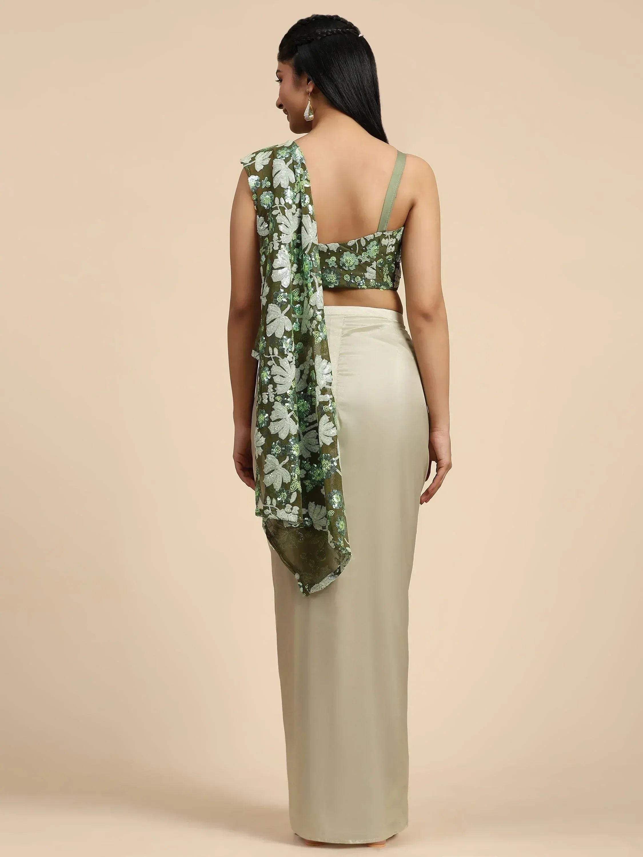 Green floral sequin crop top with off-shoulder drape, paired with cream satin palazzo pants for ethnic wear.