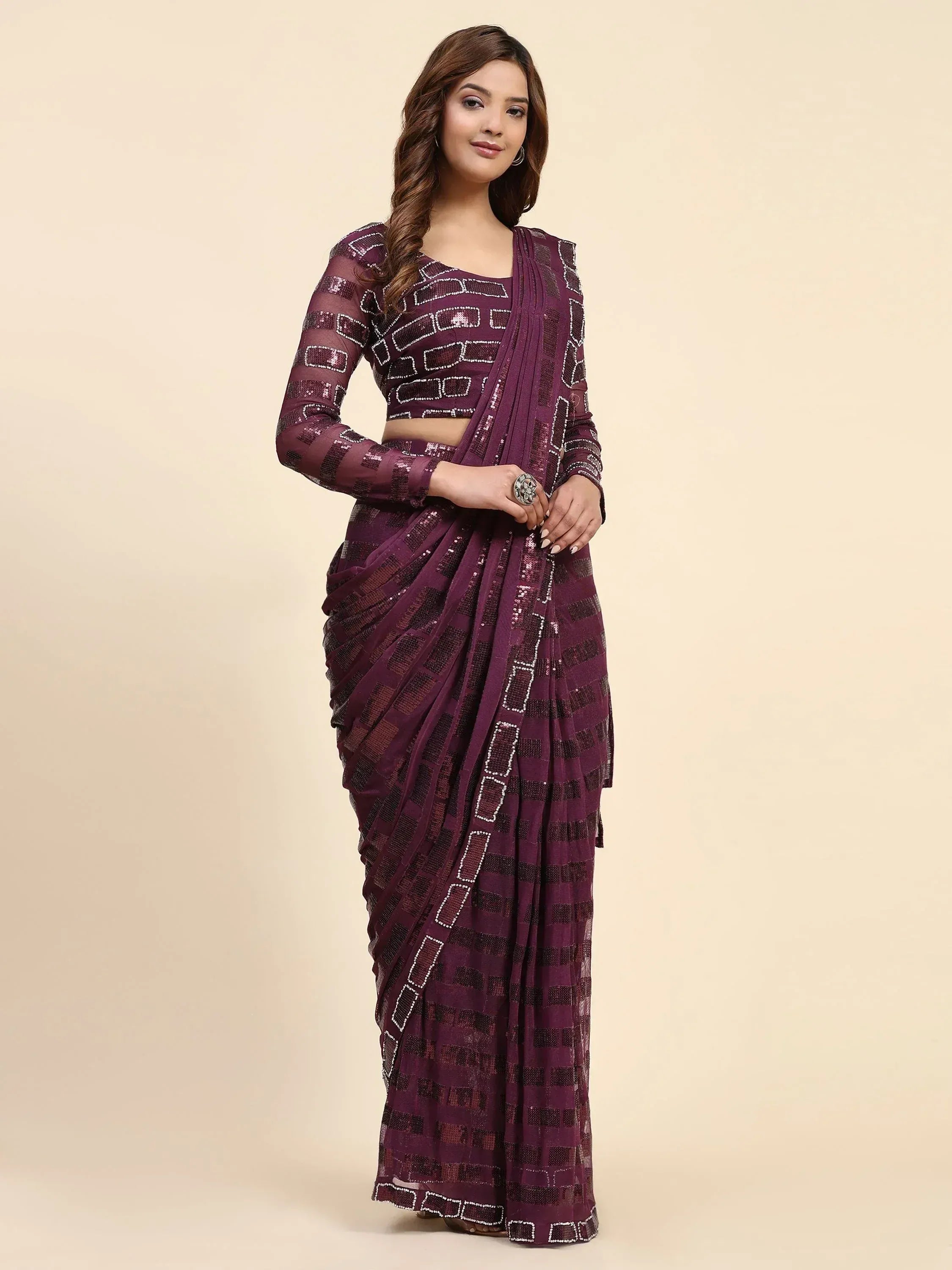 Purple sequin saree with geometric pattern, perfect for Indian ethnic wear and festive occasions.