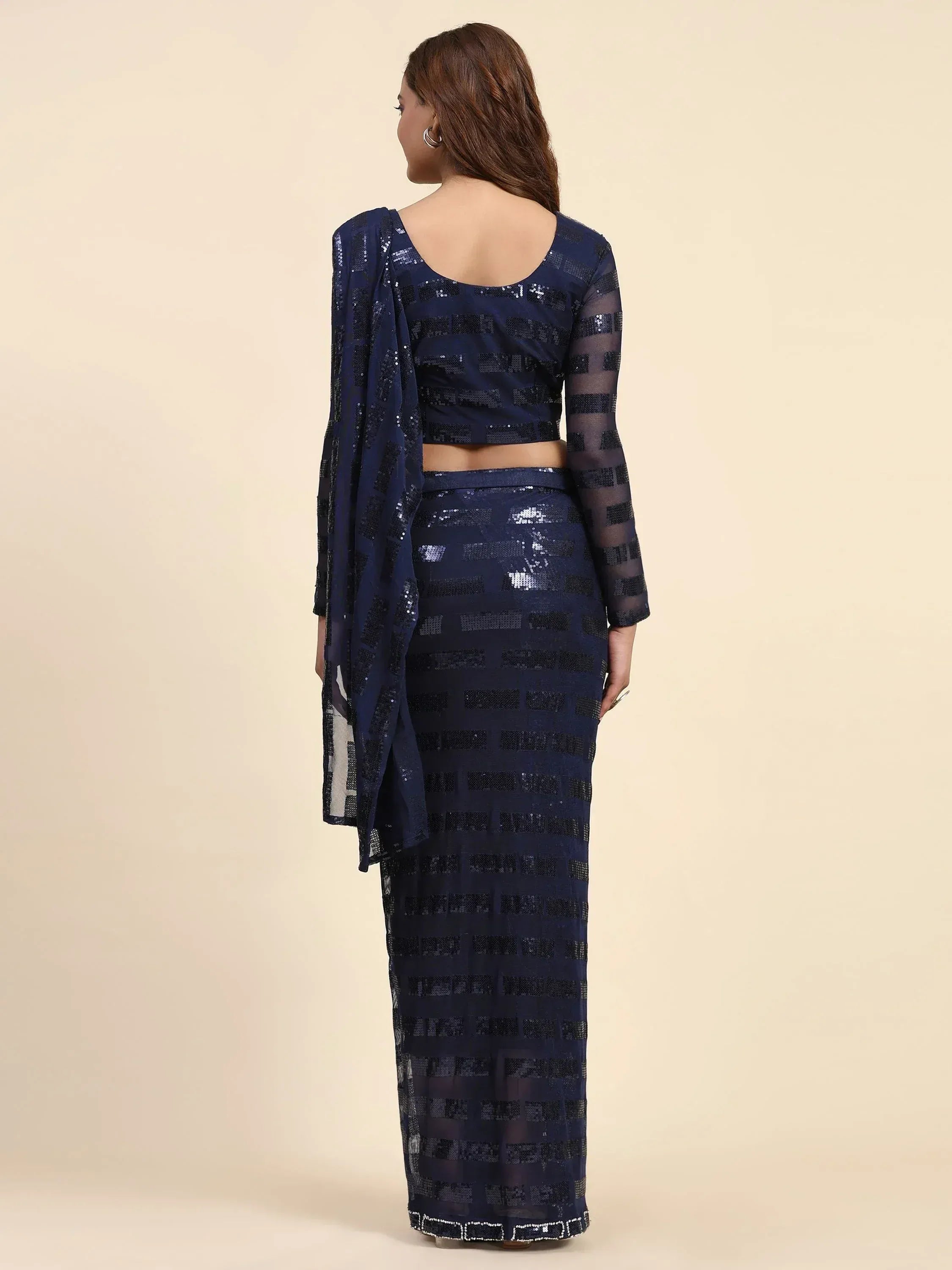Navy blue sequin saree with sheer long sleeves and backless blouse, ethnic Indian wear