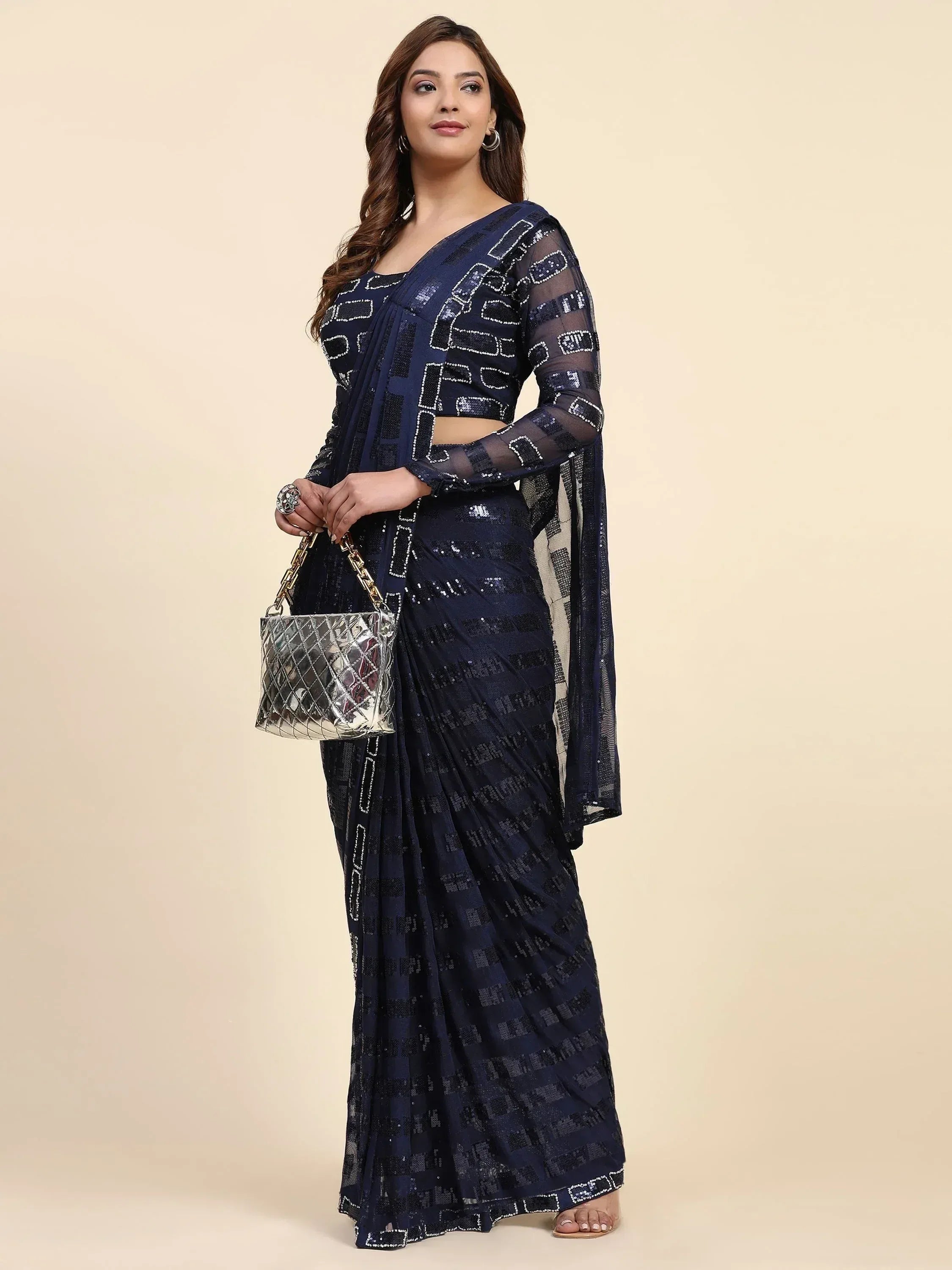 Navy blue sequin saree with sheer blouse, perfect for Indian ethnic wear occasions