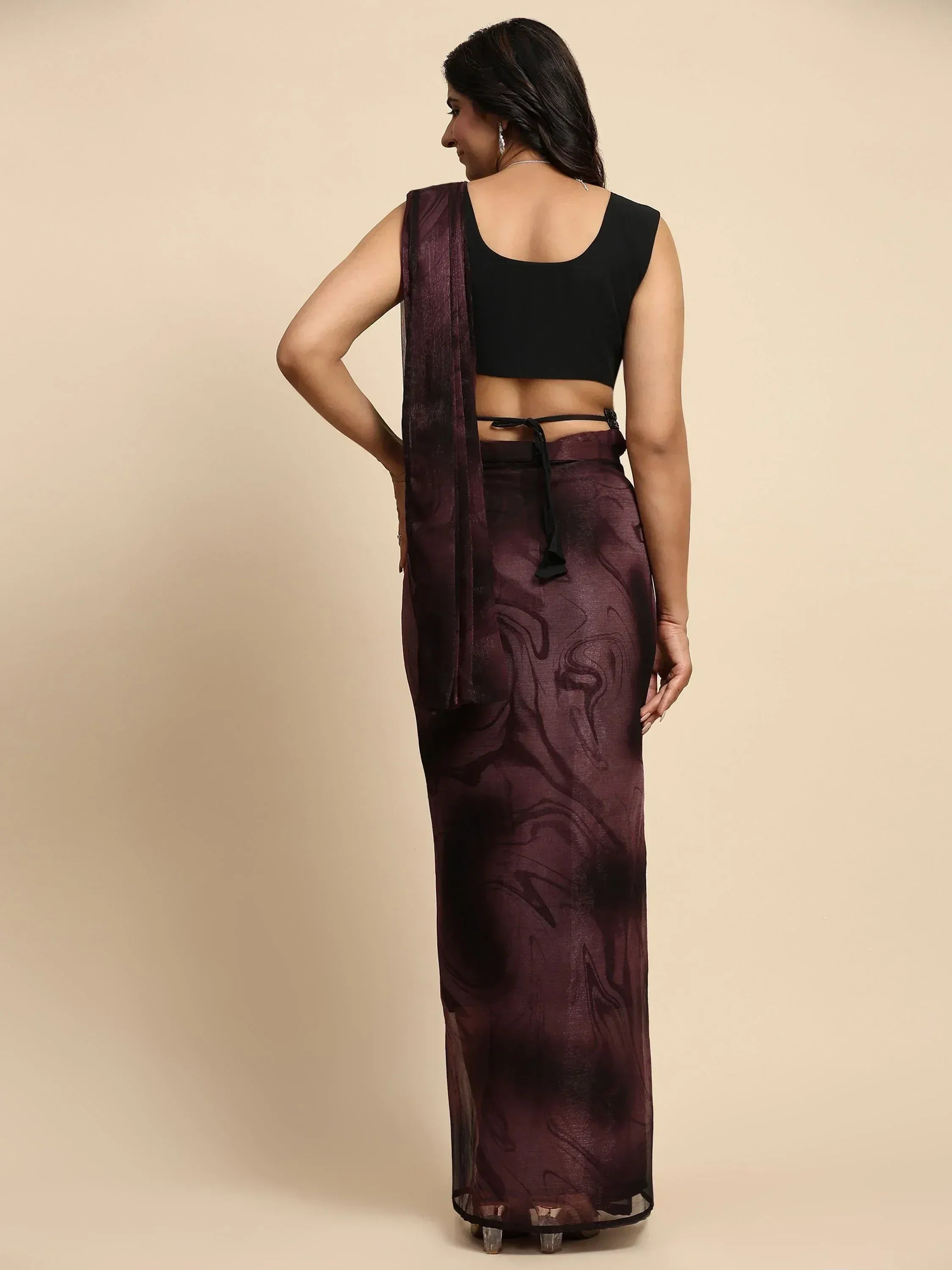 Woman in purple printed saree with black sleeveless blouse, ethnic wear for women