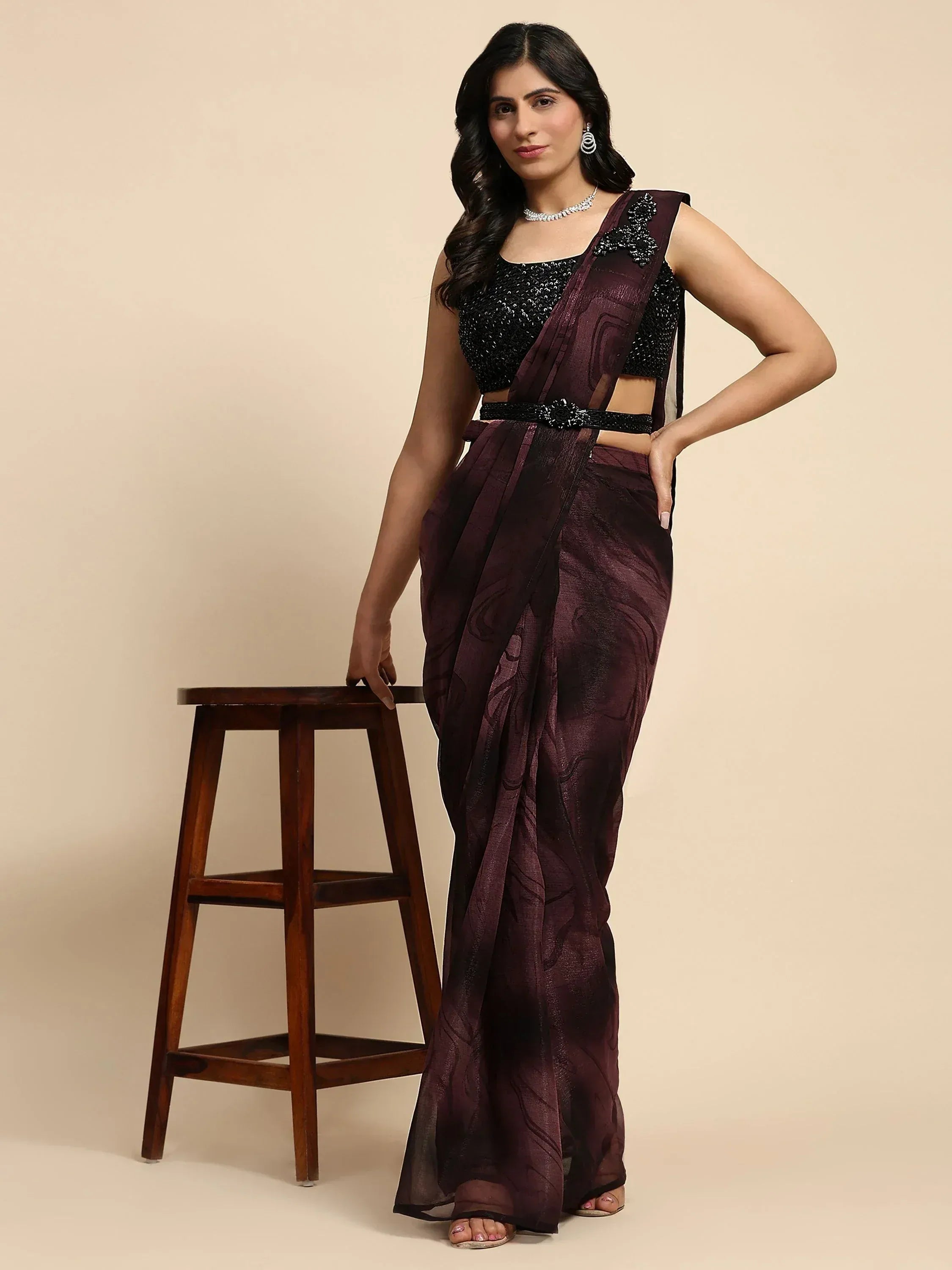 Elegant purple designer saree with black sequin blouse, perfect for Indian ethnic wear occasions