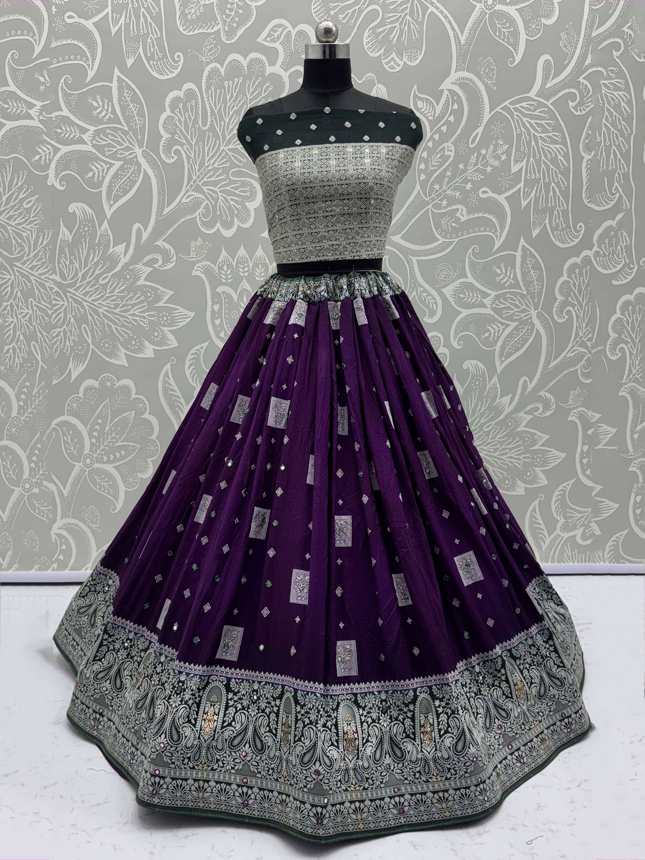 Purple and green designer lehenga choli with intricate embroidery and embellishments, perfect for Indian ethnic wear.