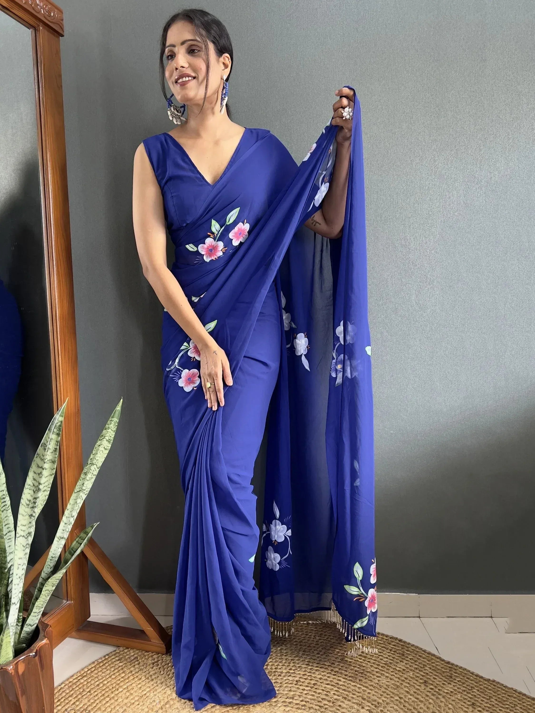 Woman in blue floral saree with V-neck blouse, ethnic Indian wear for women