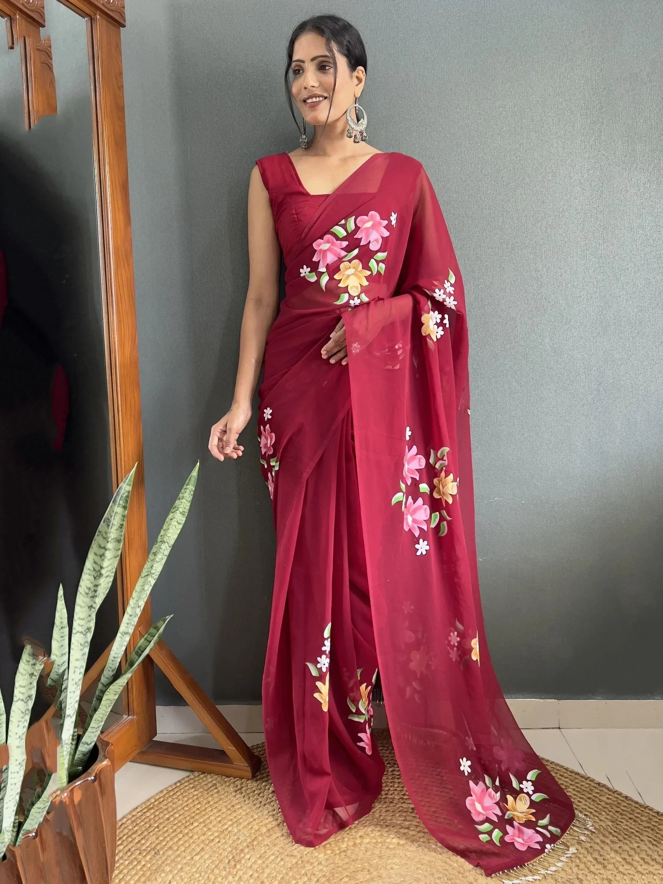 Maroon floral saree with pink and yellow flowers, elegant Indian ethnic wear for women