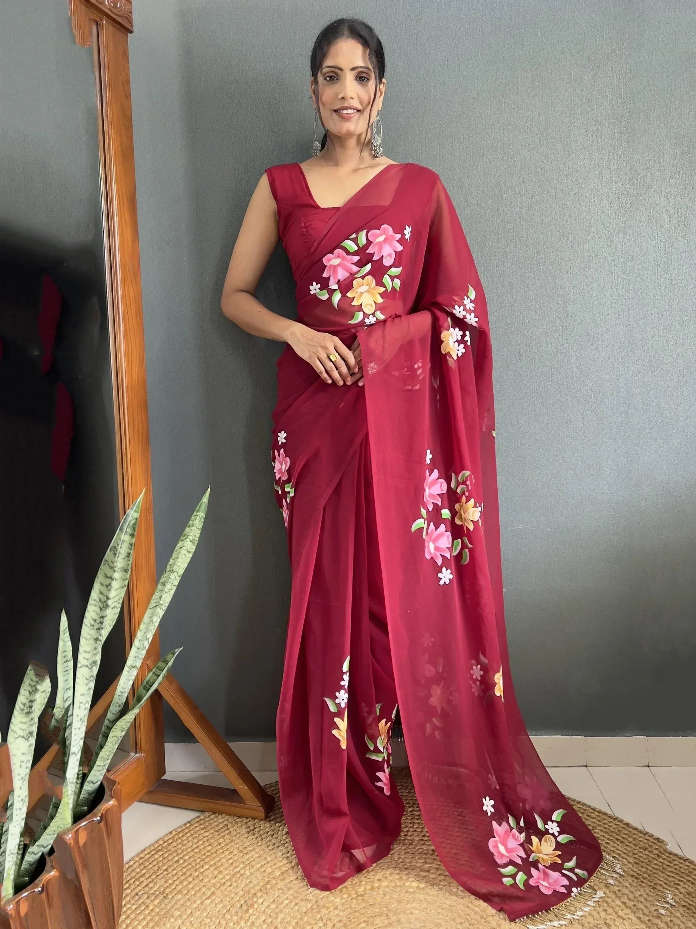 Woman in maroon floral saree with designer blouse, Indian ethnic wear