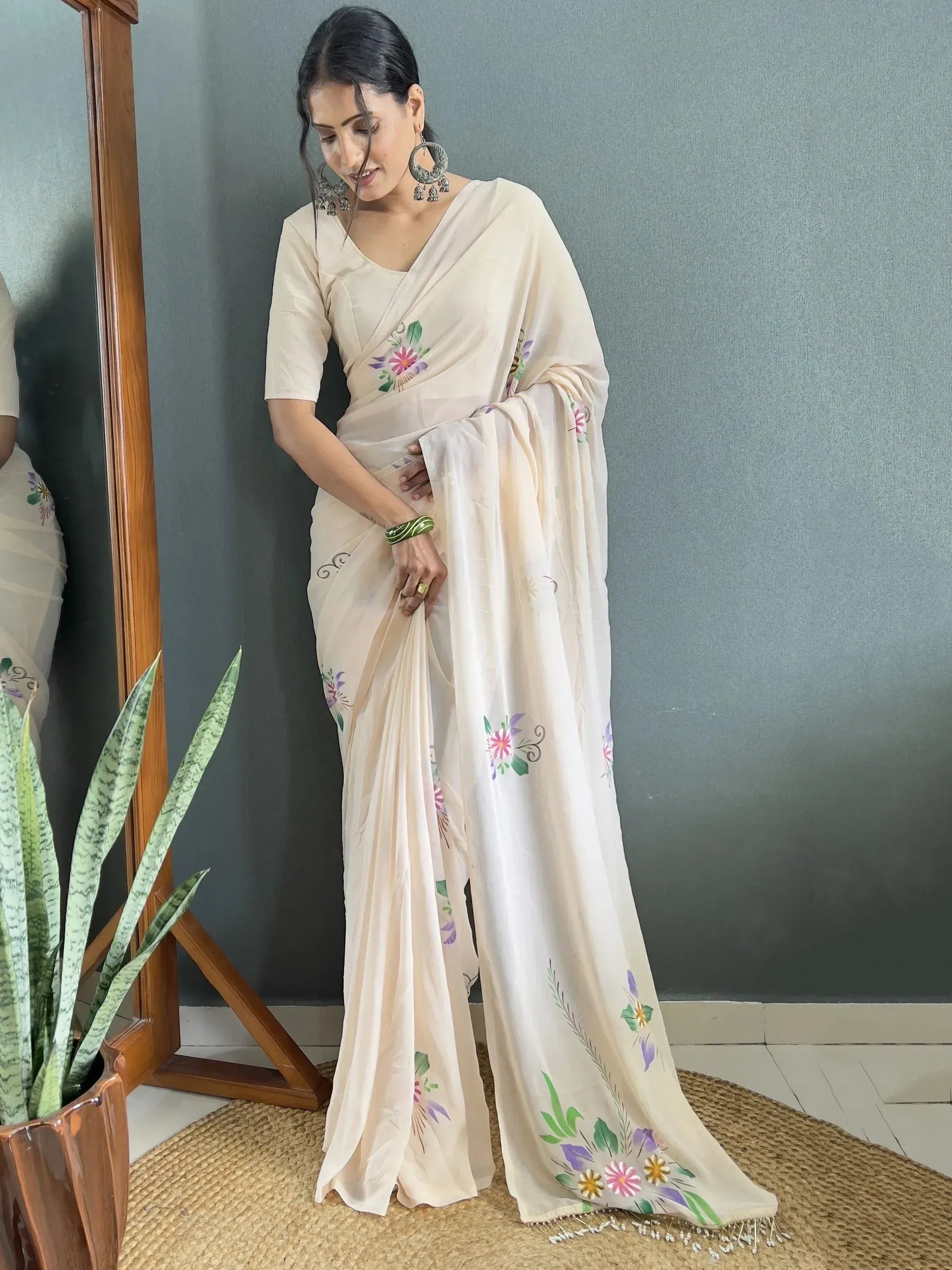 Cream floral printed saree with hand-painted motifs, perfect for Indian ethnic wear occasions.